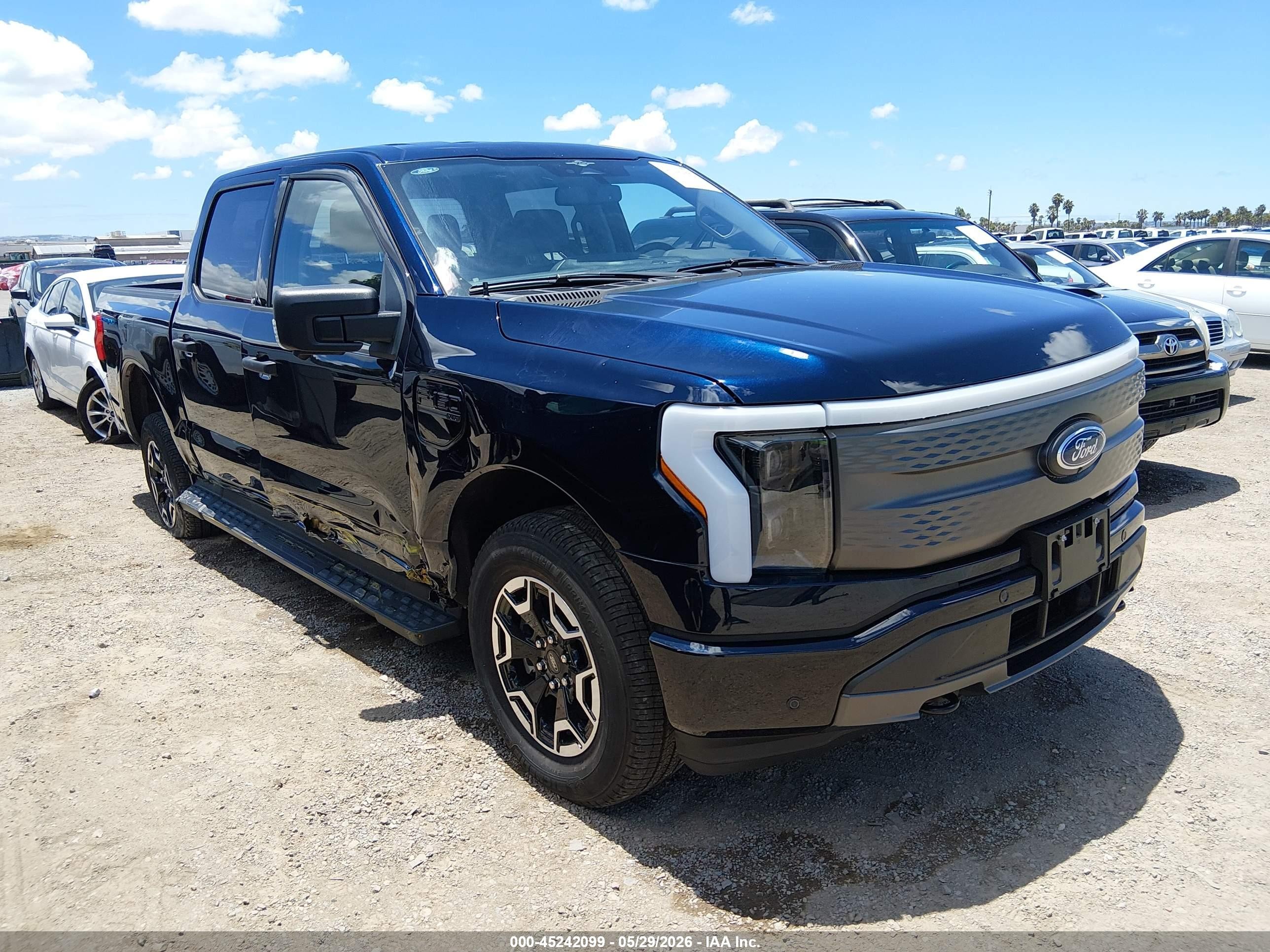 2023 Ford F-150 Lightning Pro, VIN 1FTVW1EL4PWG28700 — Side