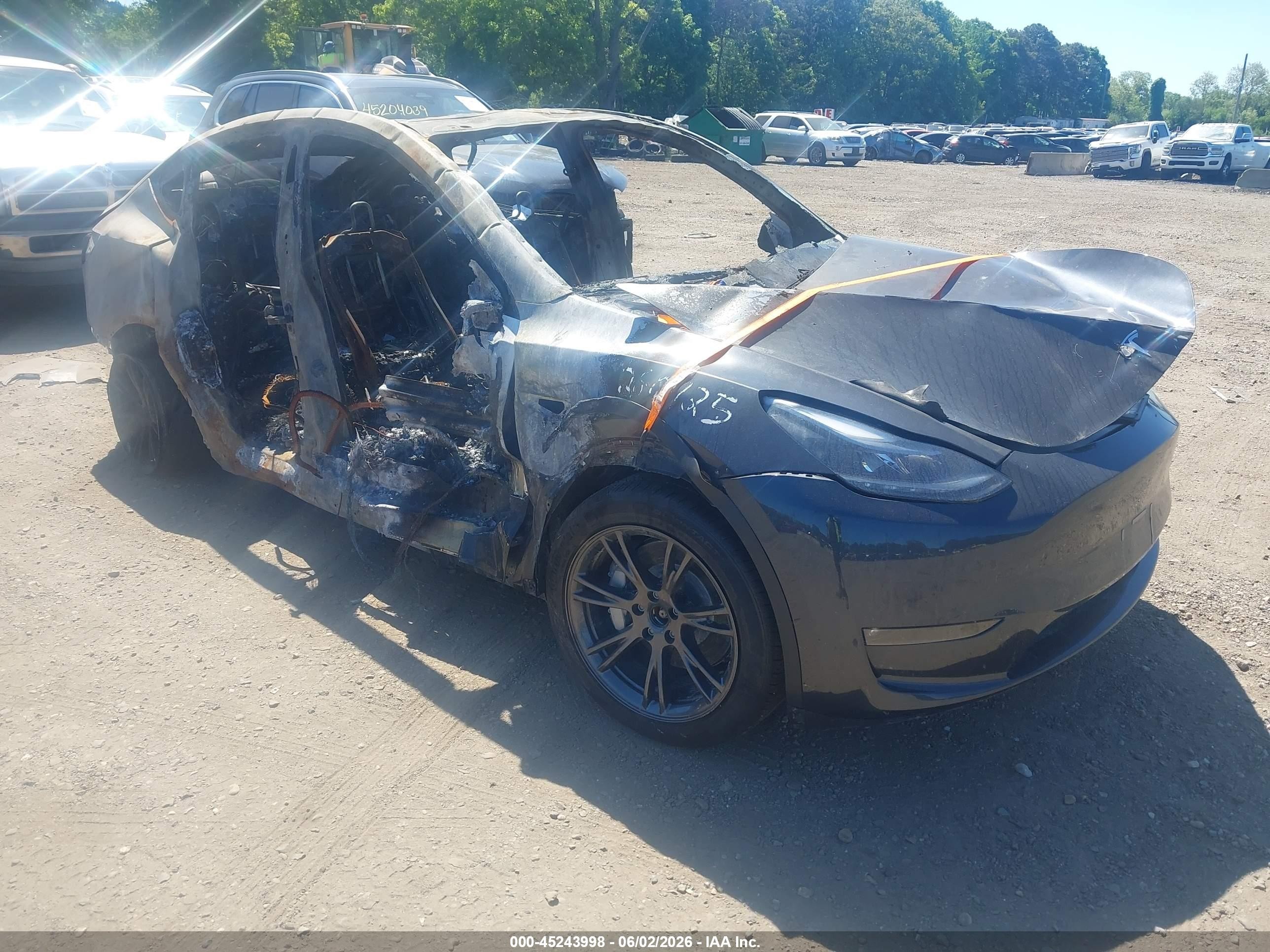 2025 Tesla Model Y Long Range, VIN 7SAYGDEEXSF306995 — Burn
