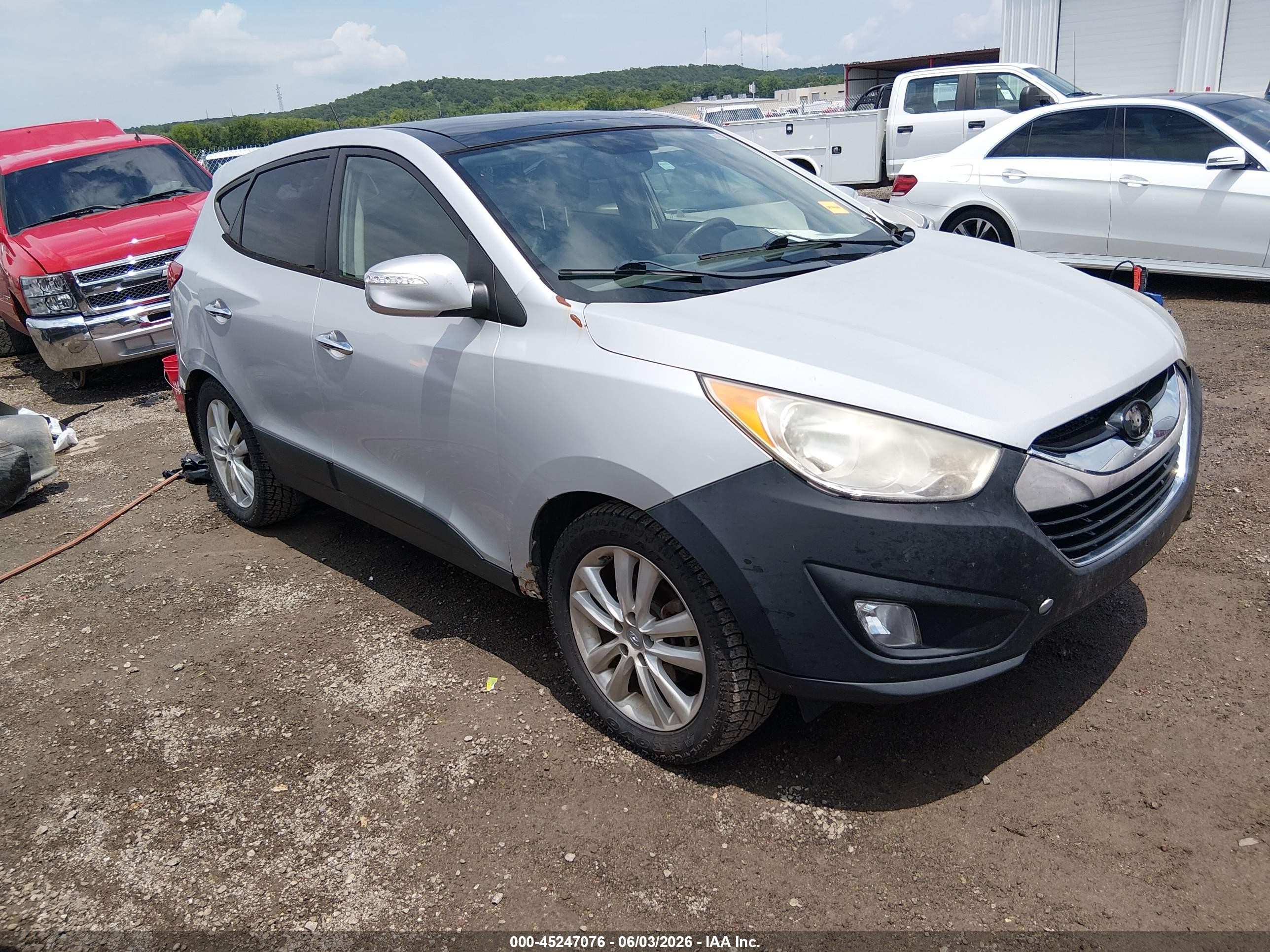 2011 Hyundai Tucson GLS, VIN KM8JUCAC4BU228416 — Side
