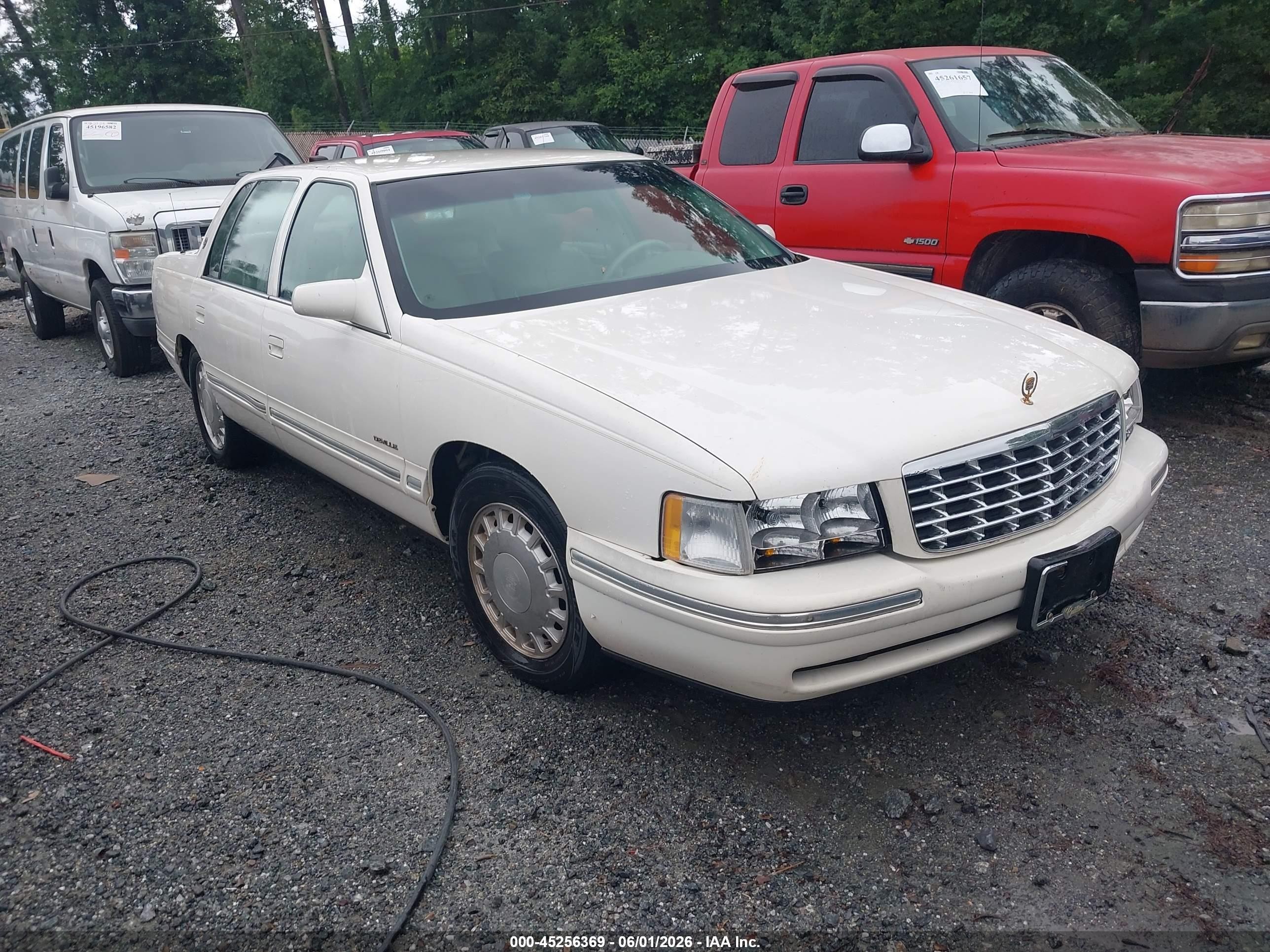 1999 Cadillac DeVille, VIN 1G6KD54Y9XU737116 — Side