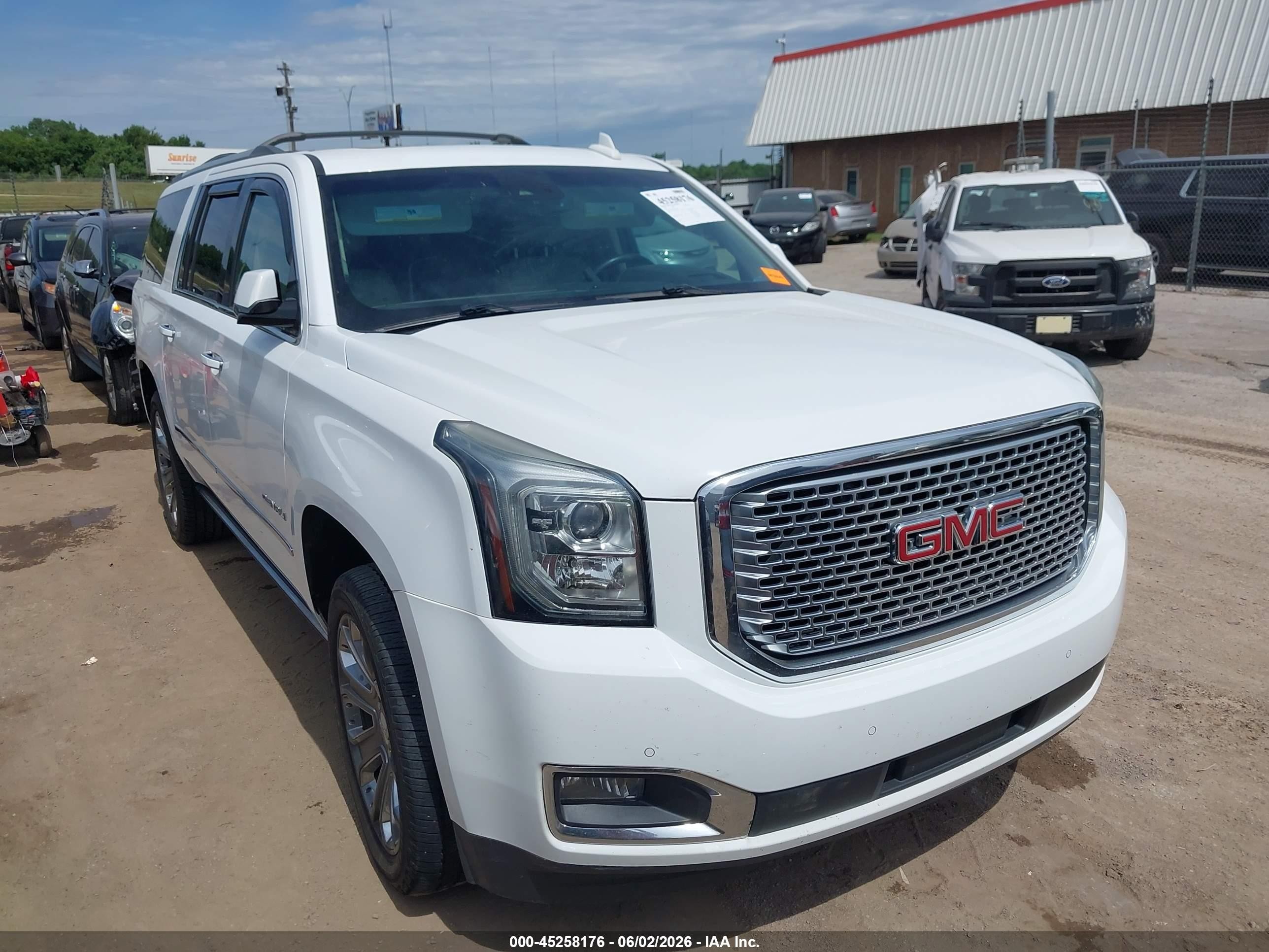 2016 GMC Yukon XL Denali, VIN 1GKS2HKJ9GR482209 — Hail