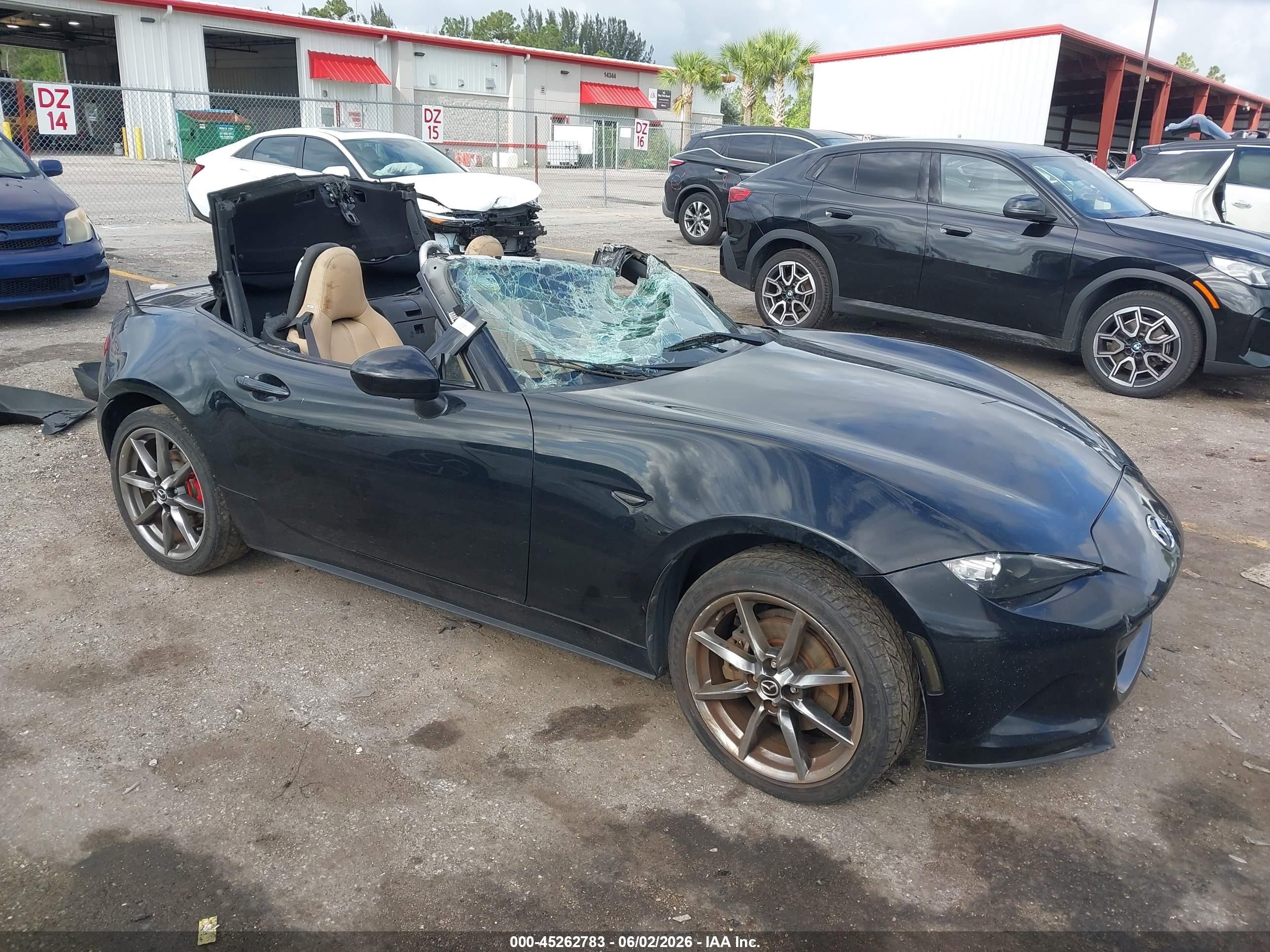 2016 Mazda MX-5 Miata Grand Touring, VIN JM1NDAD74G0110714 — Side