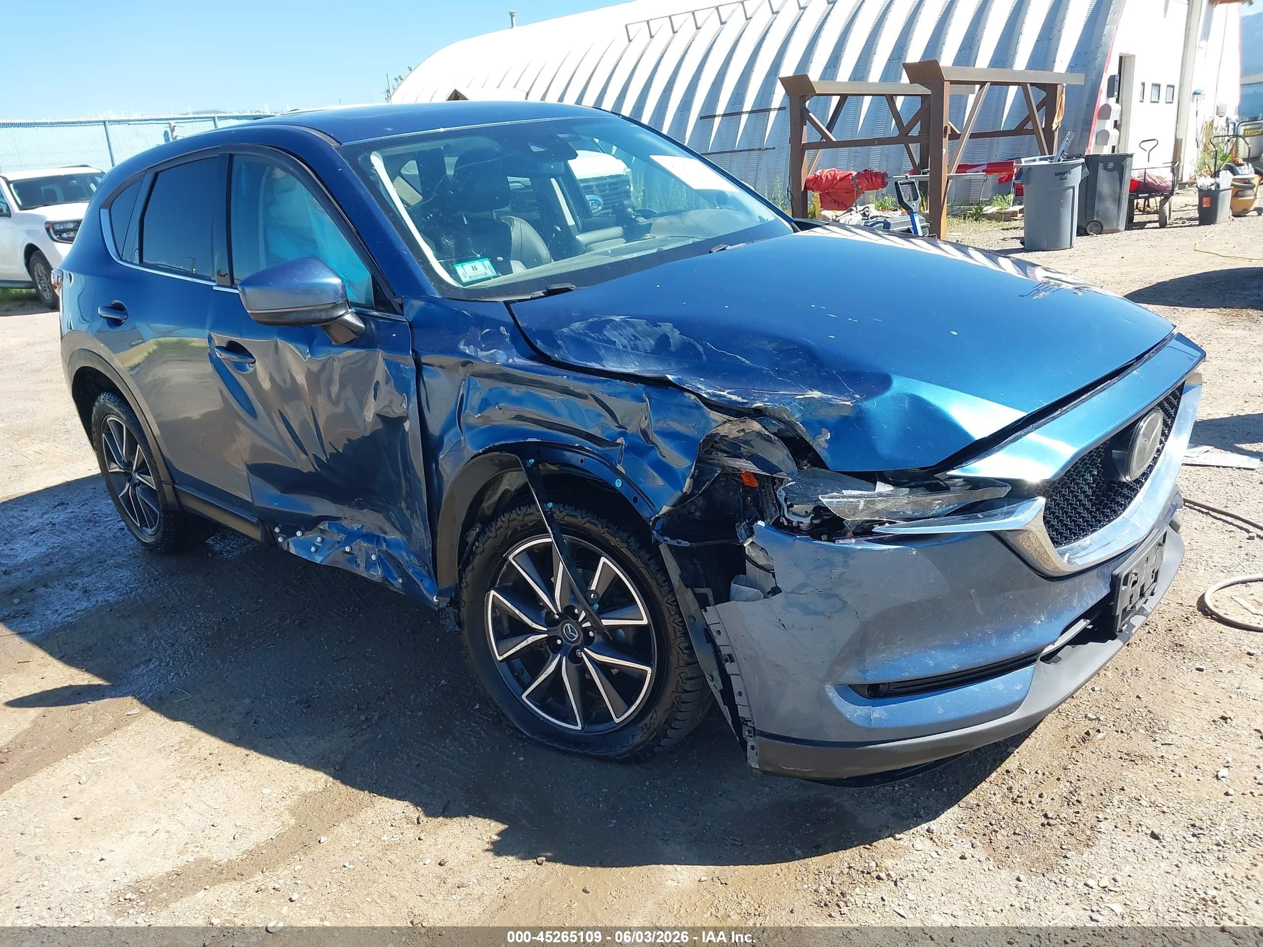2017 Mazda CX-5 Grand Touring, VIN JM3KFBDL7H0144879 — Бок
