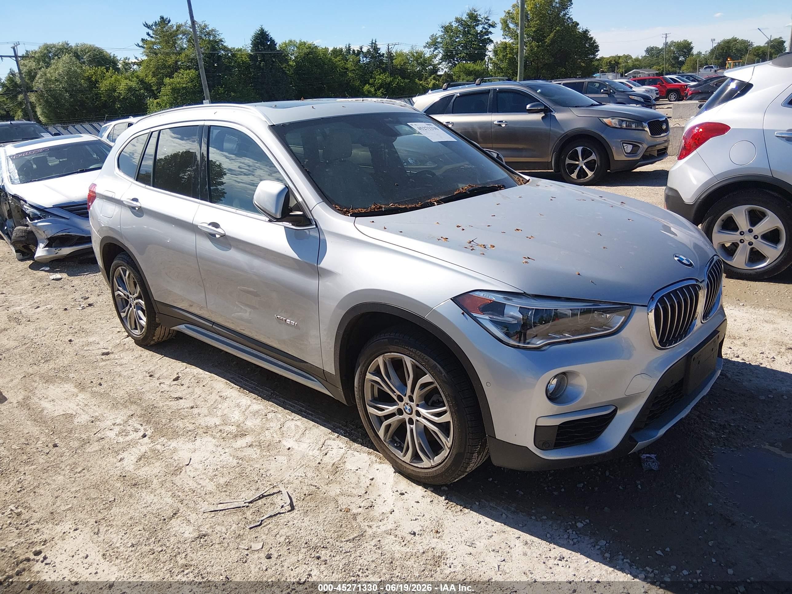 2017 BMW X1 xDrive28i, VIN WBXHT3C32H5F74296 — Rear end