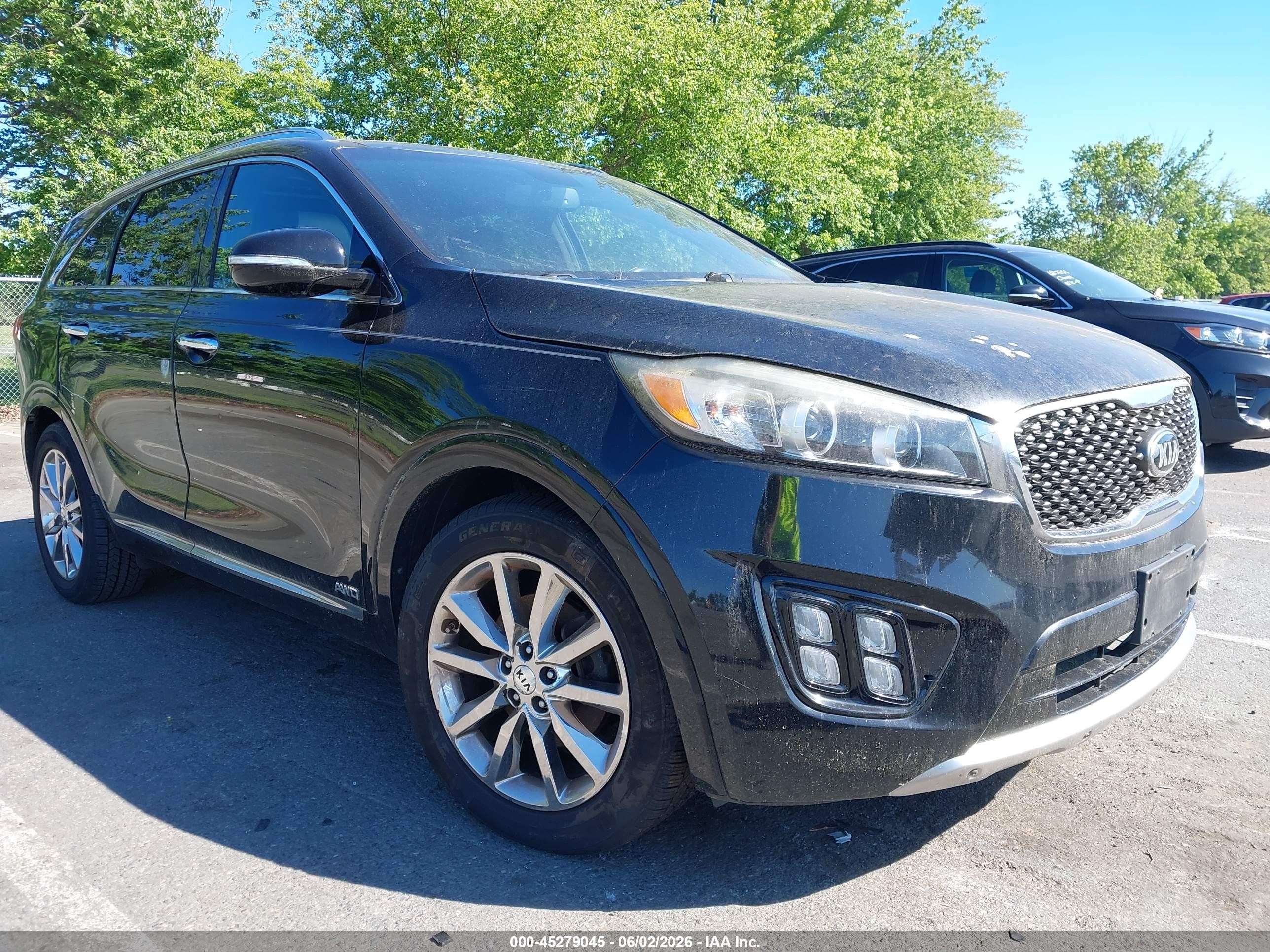 2016 Kia Sorento SX, VIN 5XYPKDA5XGG028497 — Side