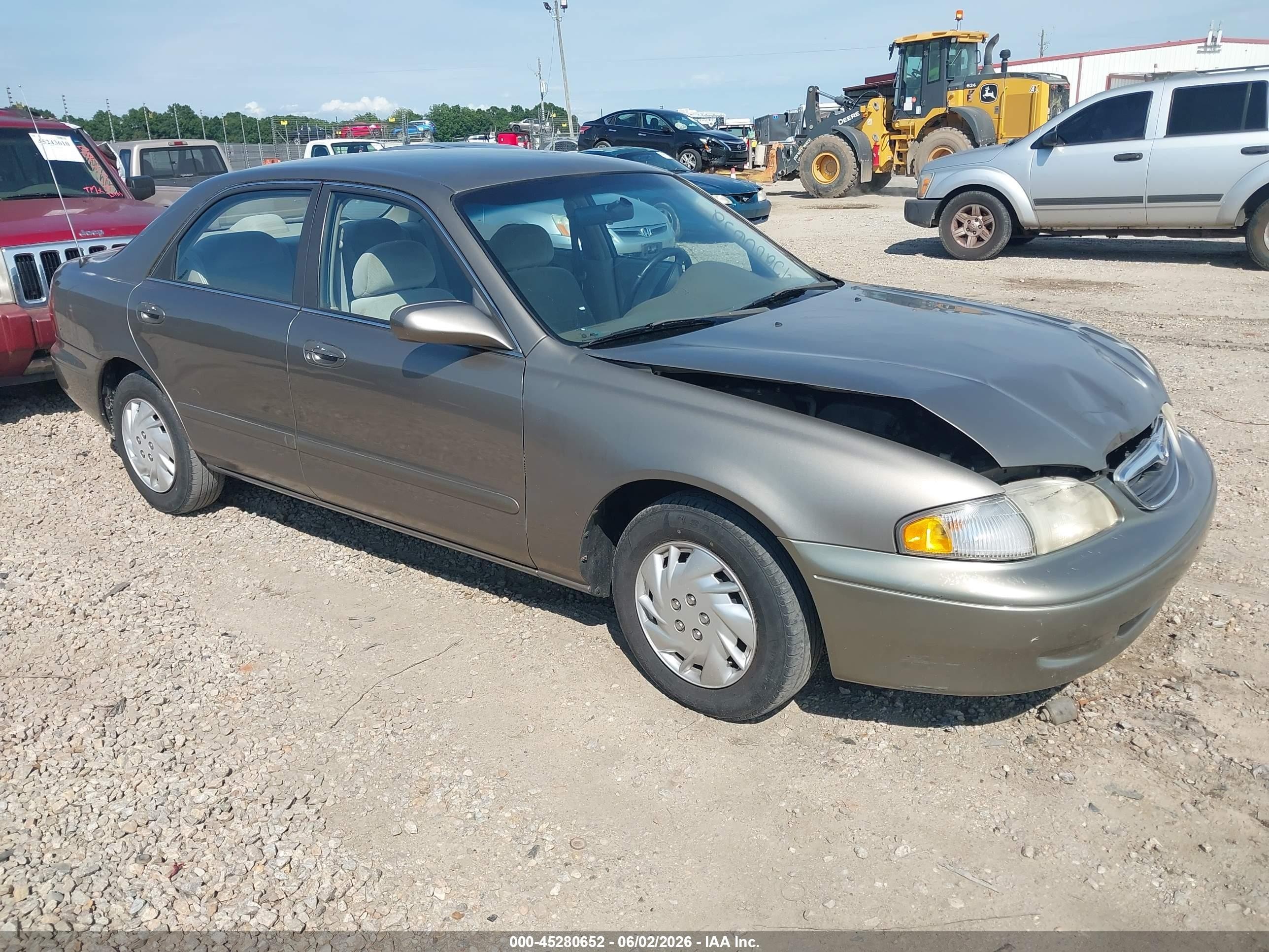 1999 Mazda 626 ES, VIN 1YVGF22C7X5865541 — Front end