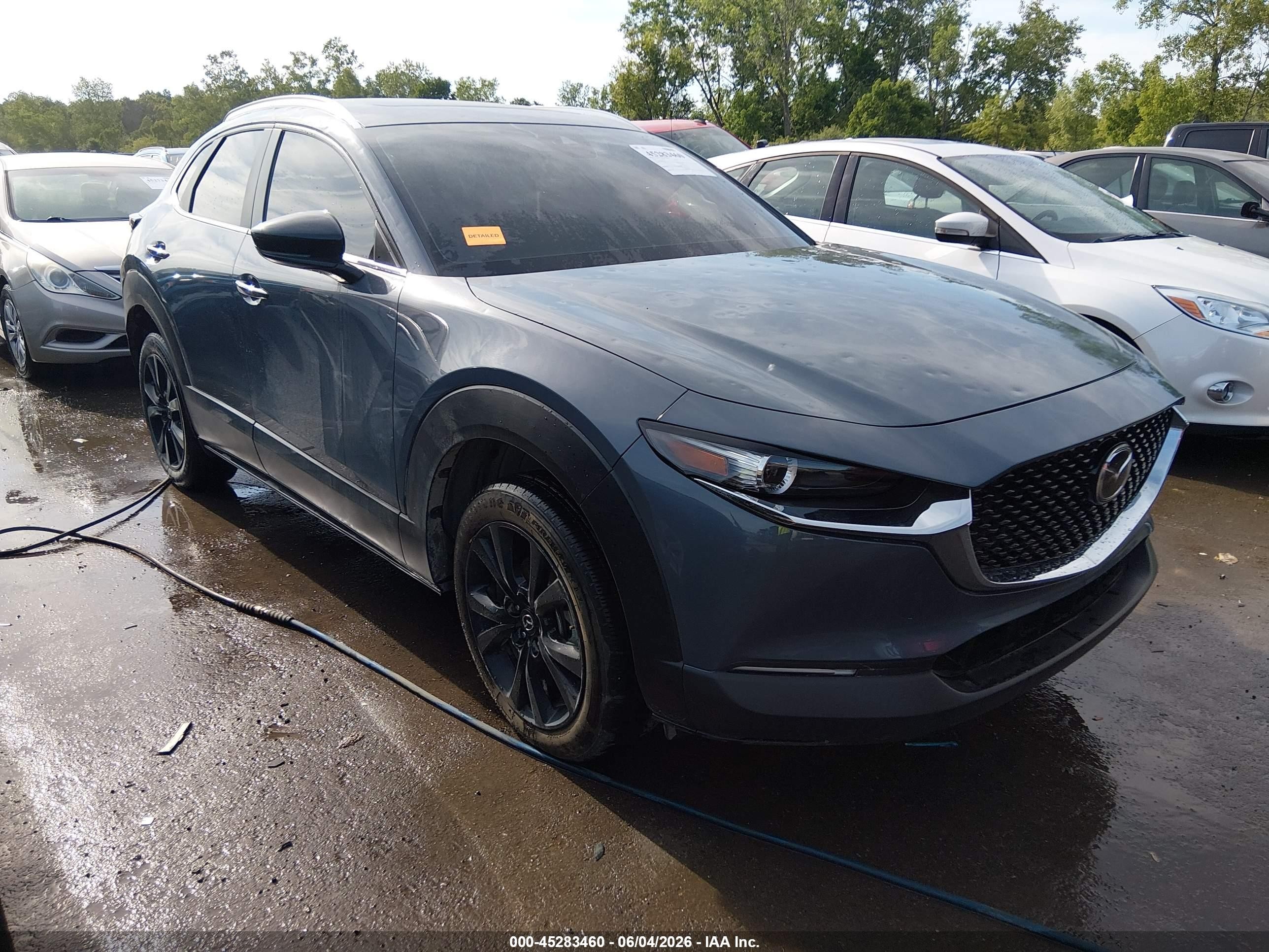2022 Mazda CX-30 S Carbon Edition, VIN 3MVDMBCL4NM419060 — Hail