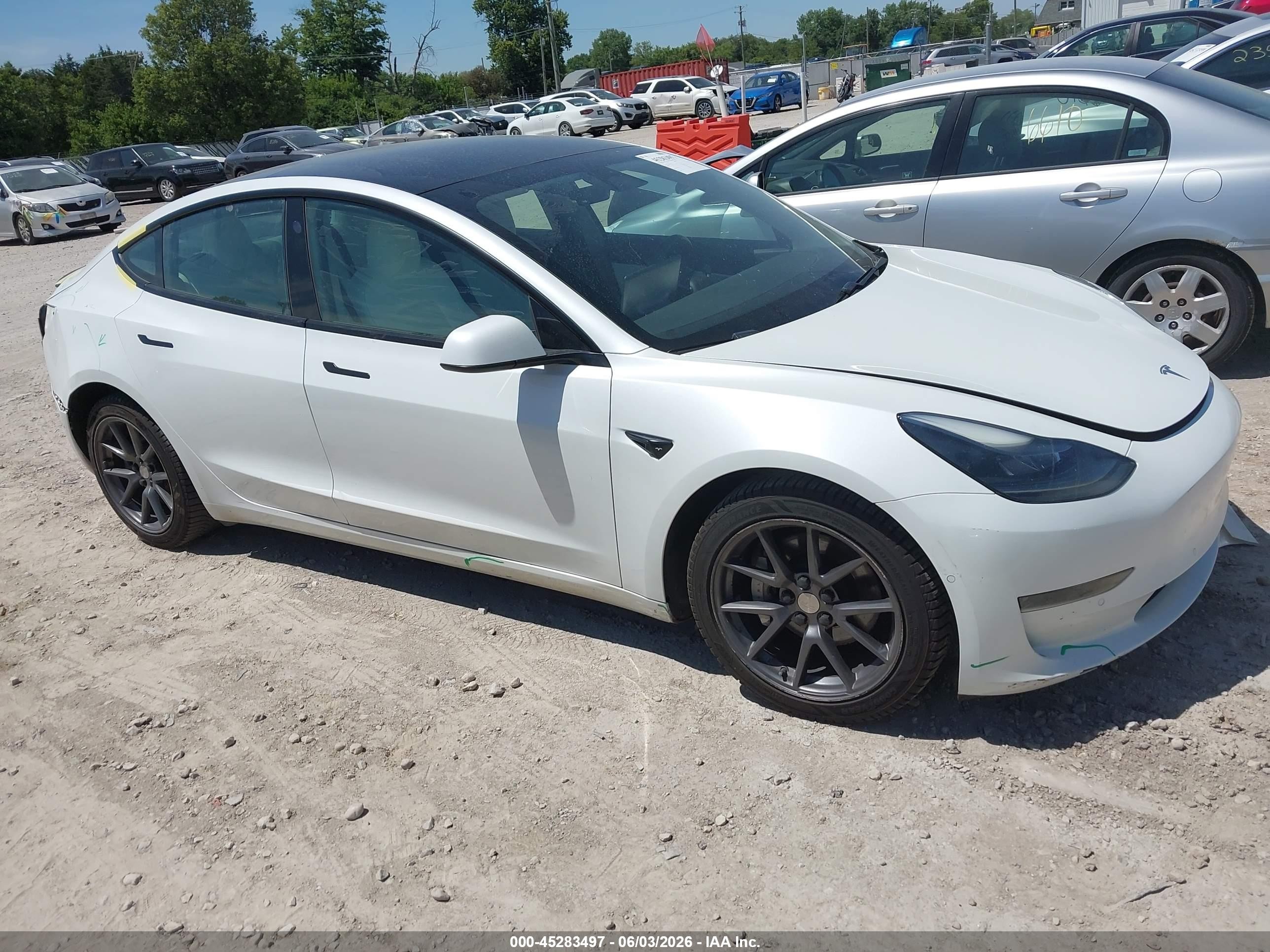 2021 Tesla Model 3 Standard Range Plus, VIN 5YJ3E1EA6MF921703 — Rear end
