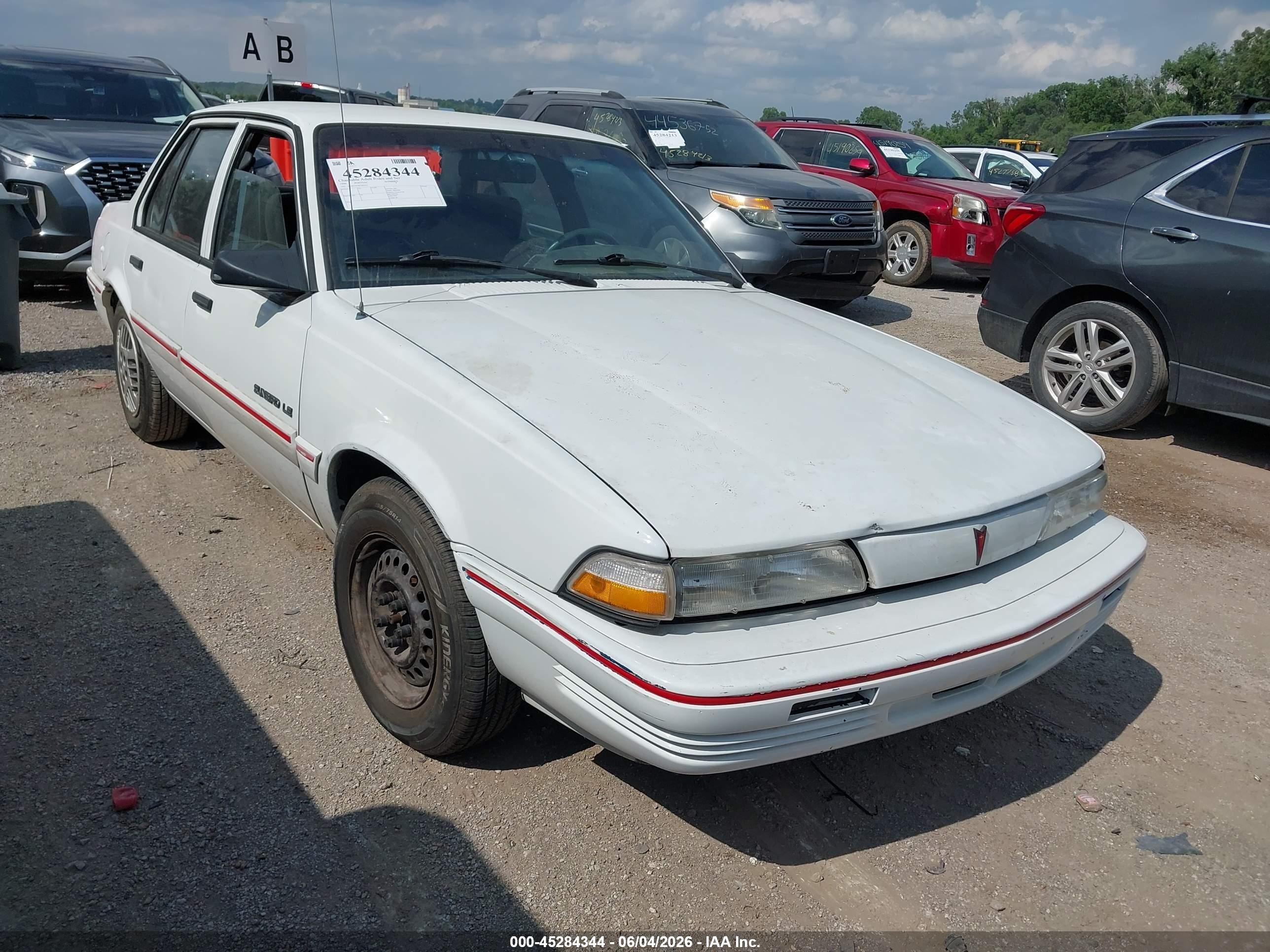 1994 Pontiac Sunbird LE, VIN 1G2JB54H5R7582455 — Normal wear