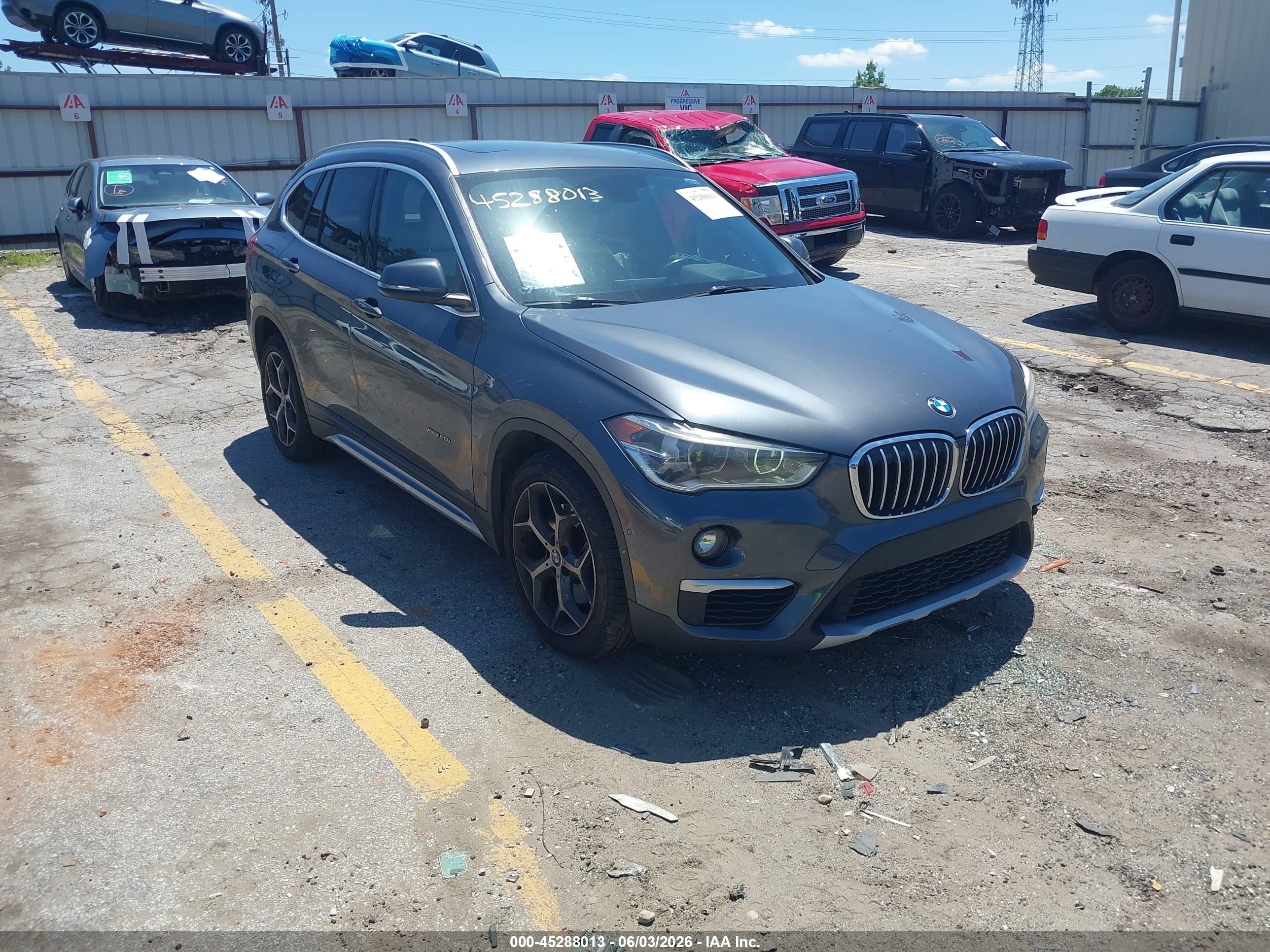2018 BMW X1 xDrive28i, VIN WBXHT3C33J5L24200 — Side