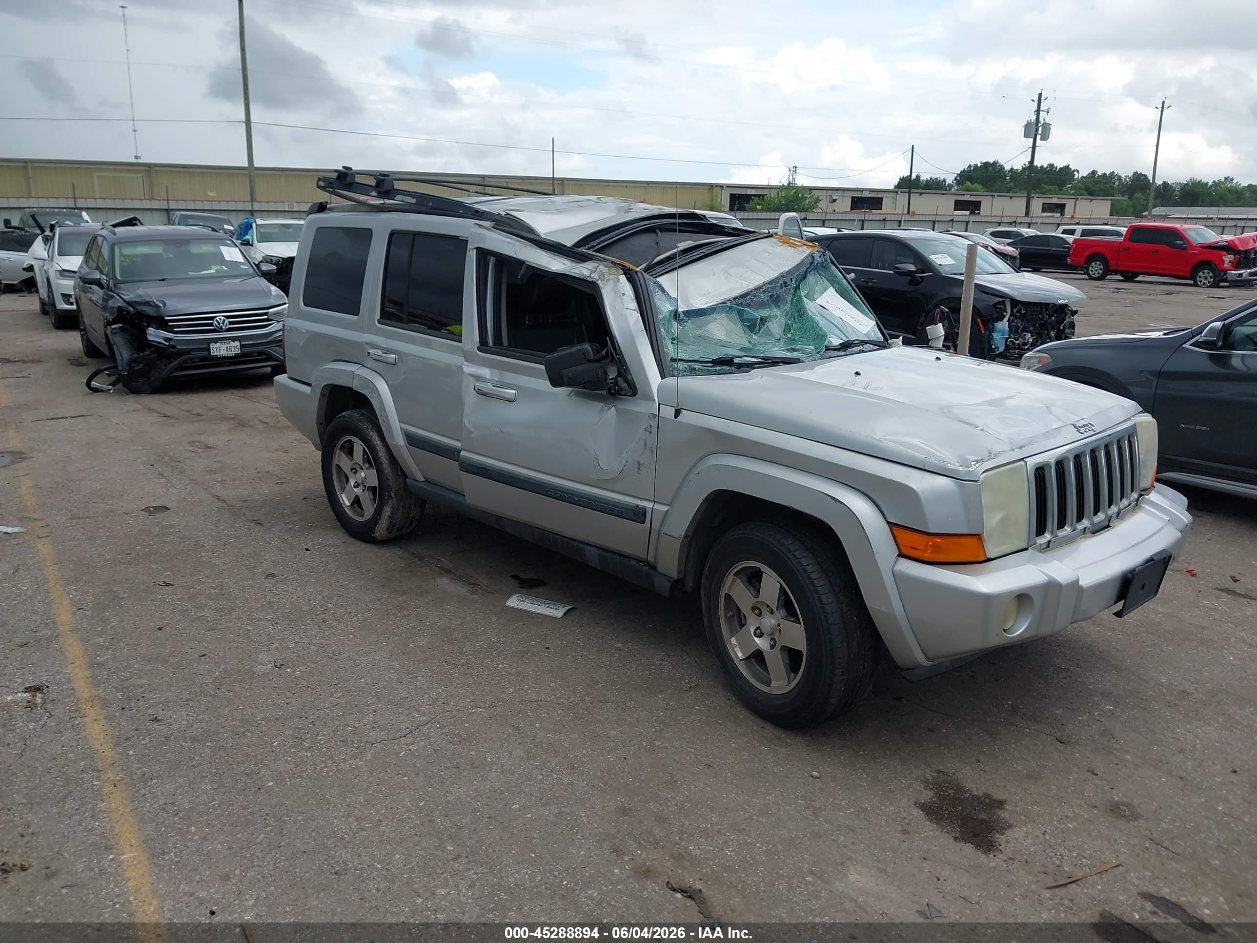 2009 Jeep Commander Sport, VIN 1J8HH48KX9C516007 — Rollover