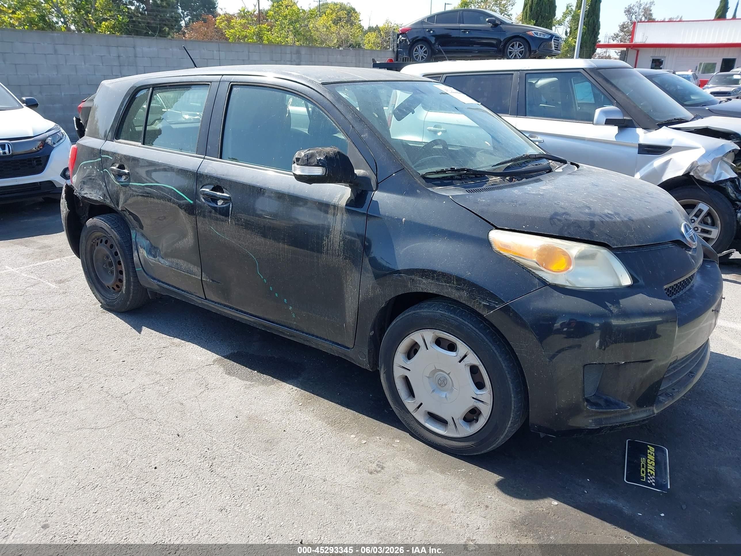 2011 Scion xD, VIN JTKKU4B44B1013814 — Side