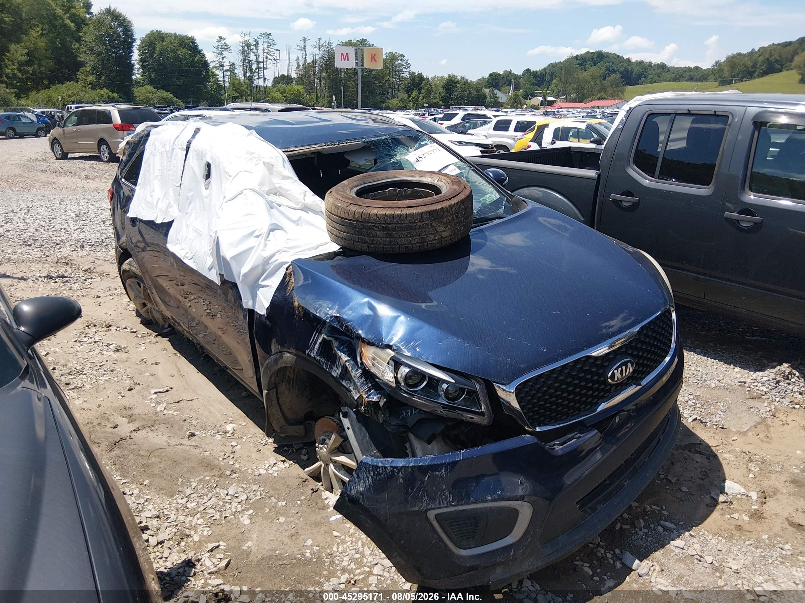 2016 Kia Sorento LX, VIN 5XYPG4A34GG062578 — Rollover