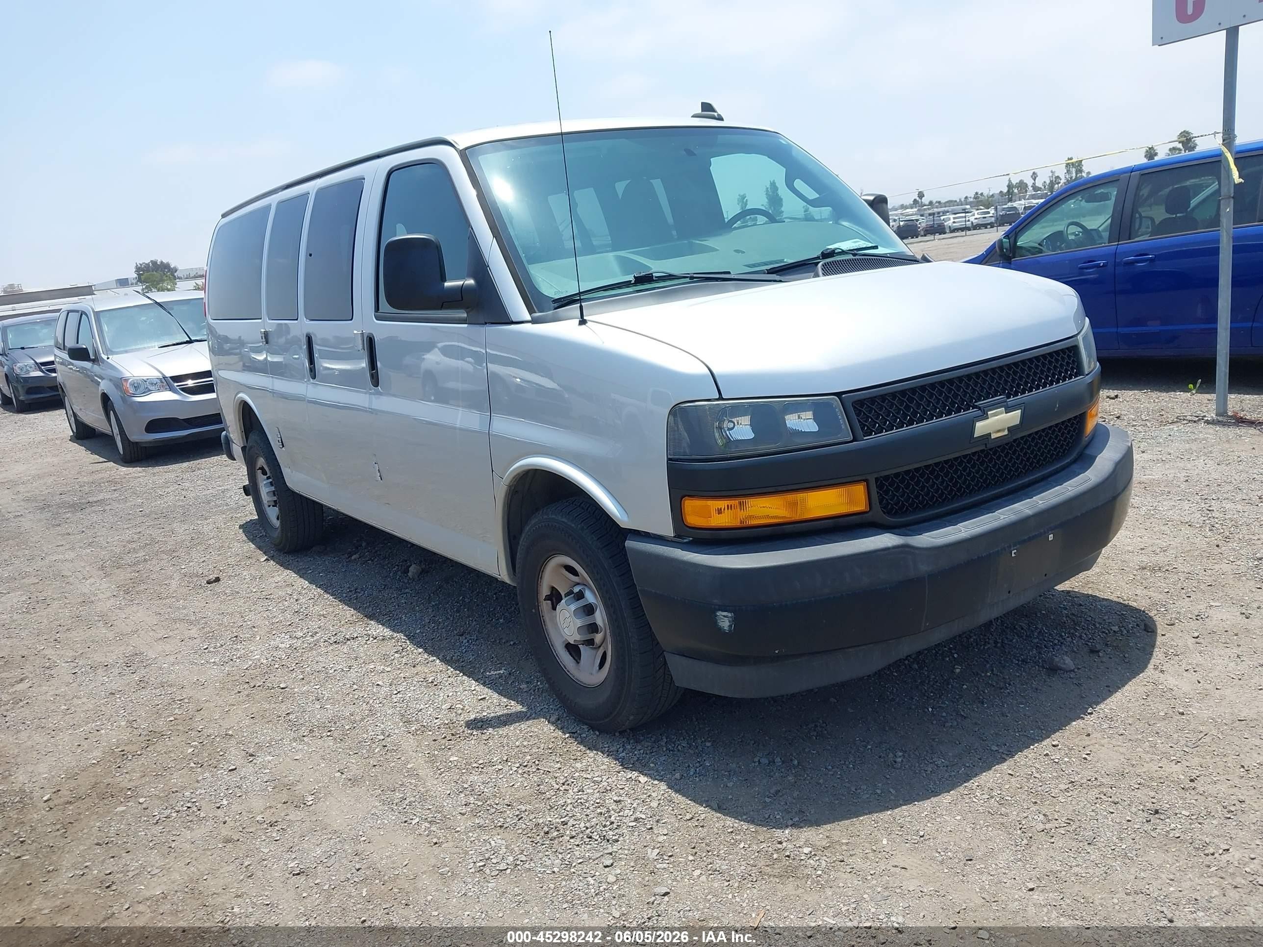 2018 Chevrolet Express Passenger LS, VIN 1GAWGEFG9J1300373 — Side