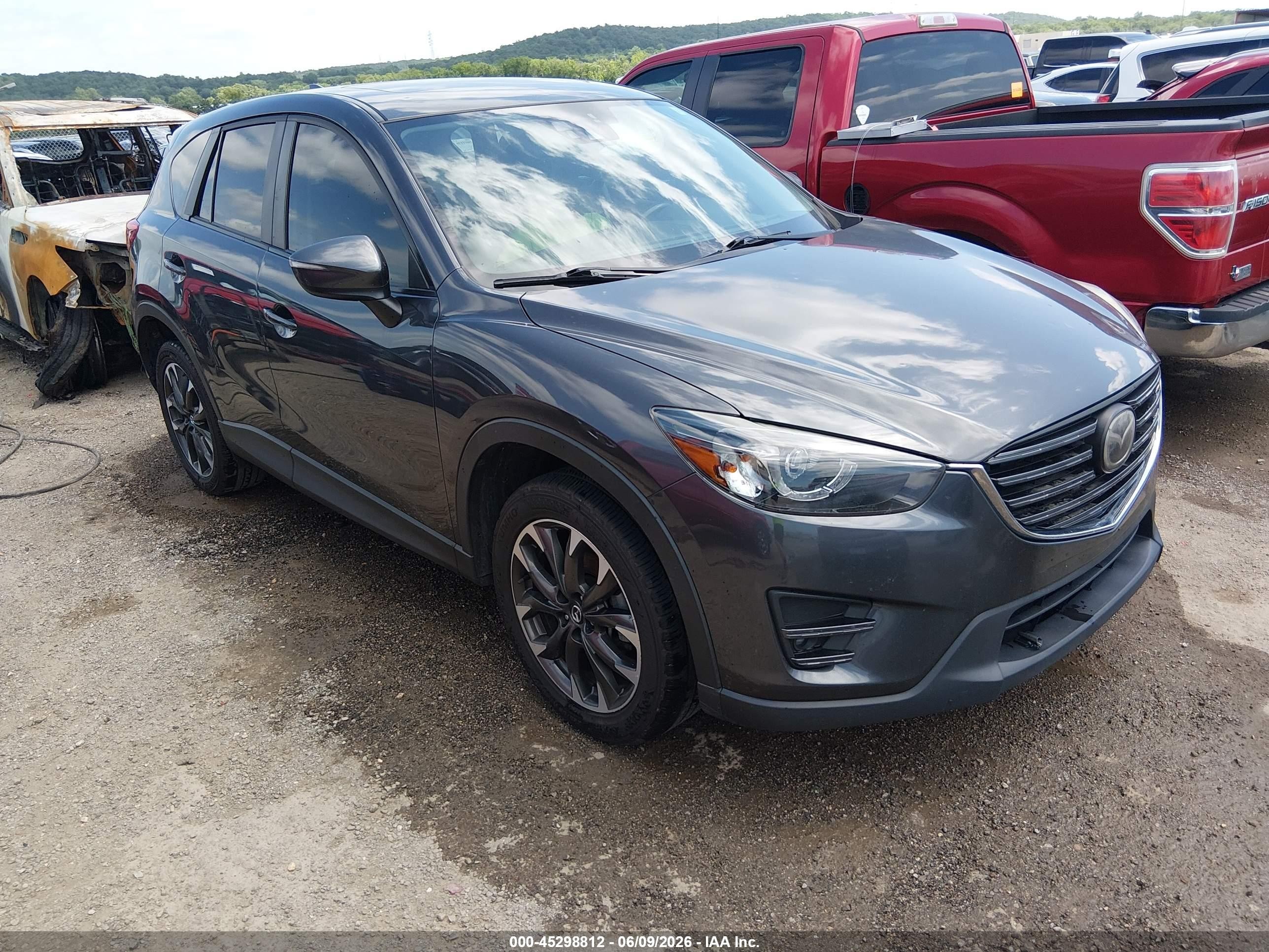 2016 Mazda CX-5 Grand Touring, VIN JM3KE2DY0G0854736 — Hail
