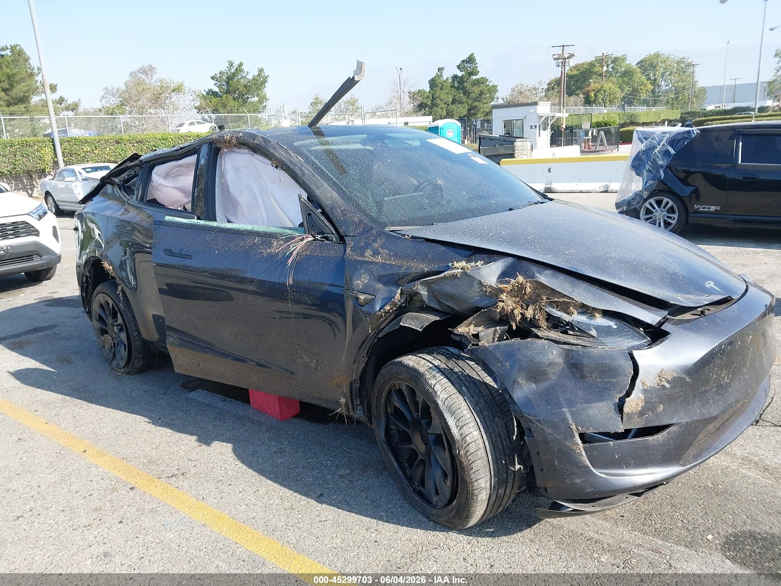 2024 Tesla Model Y Long Range, VIN 7SAYGDEE1RA233359 — Rollover