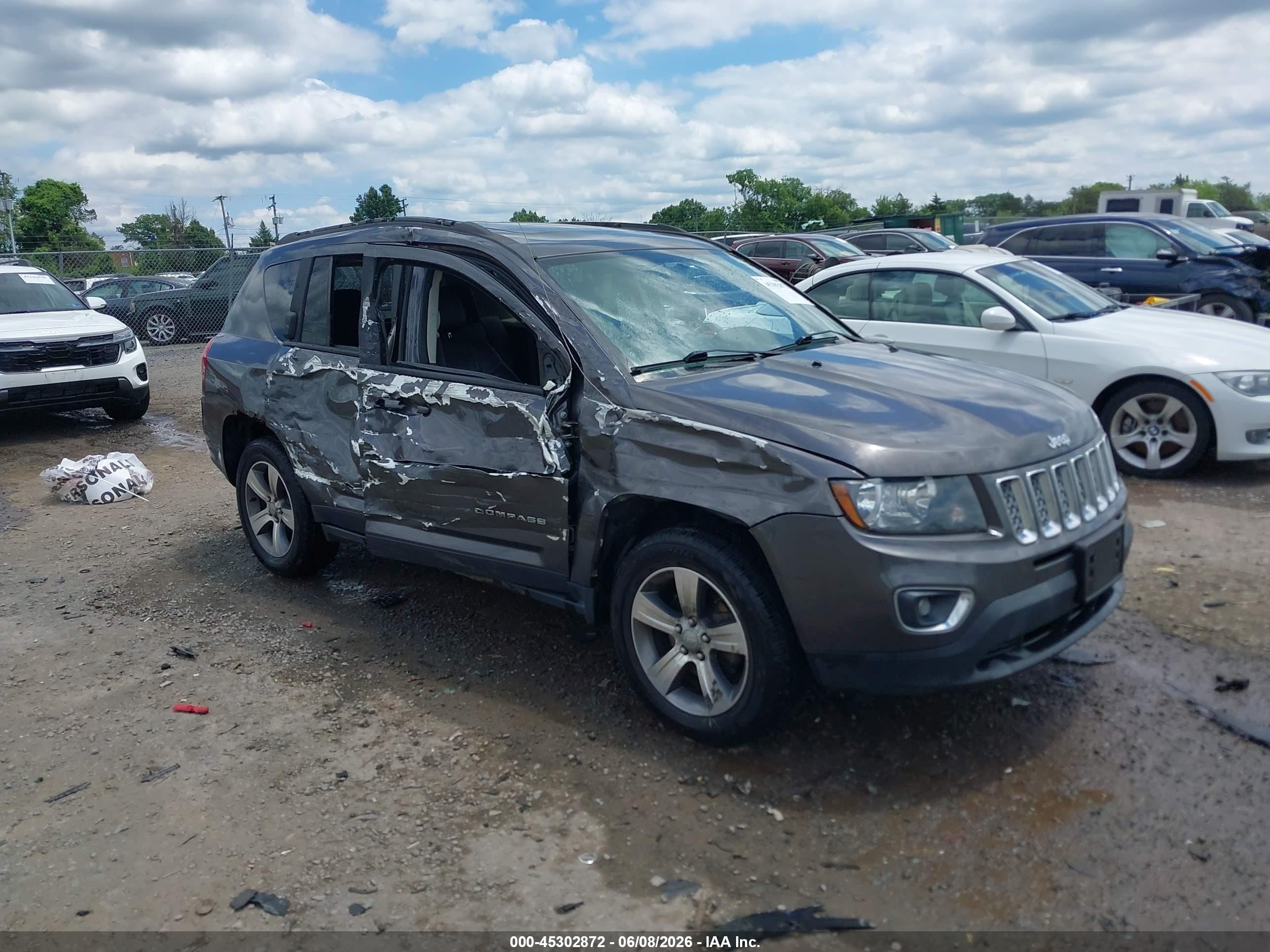 2016 Jeep Compass High Altitude, VIN 1C4NJDEB5GD798874 — Side
