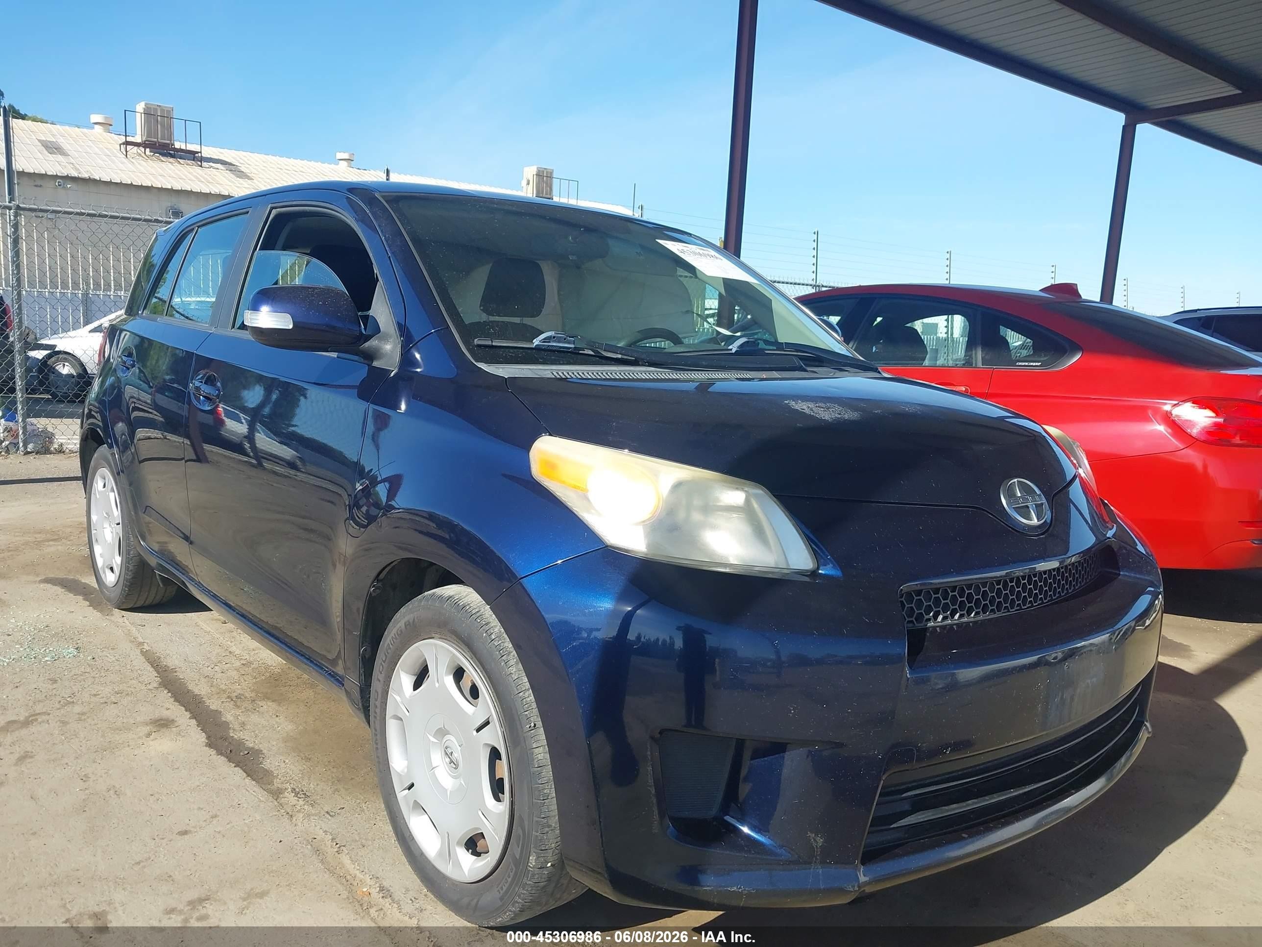 2012 Scion xD, VIN JTKKU4B43C1019959 — Side