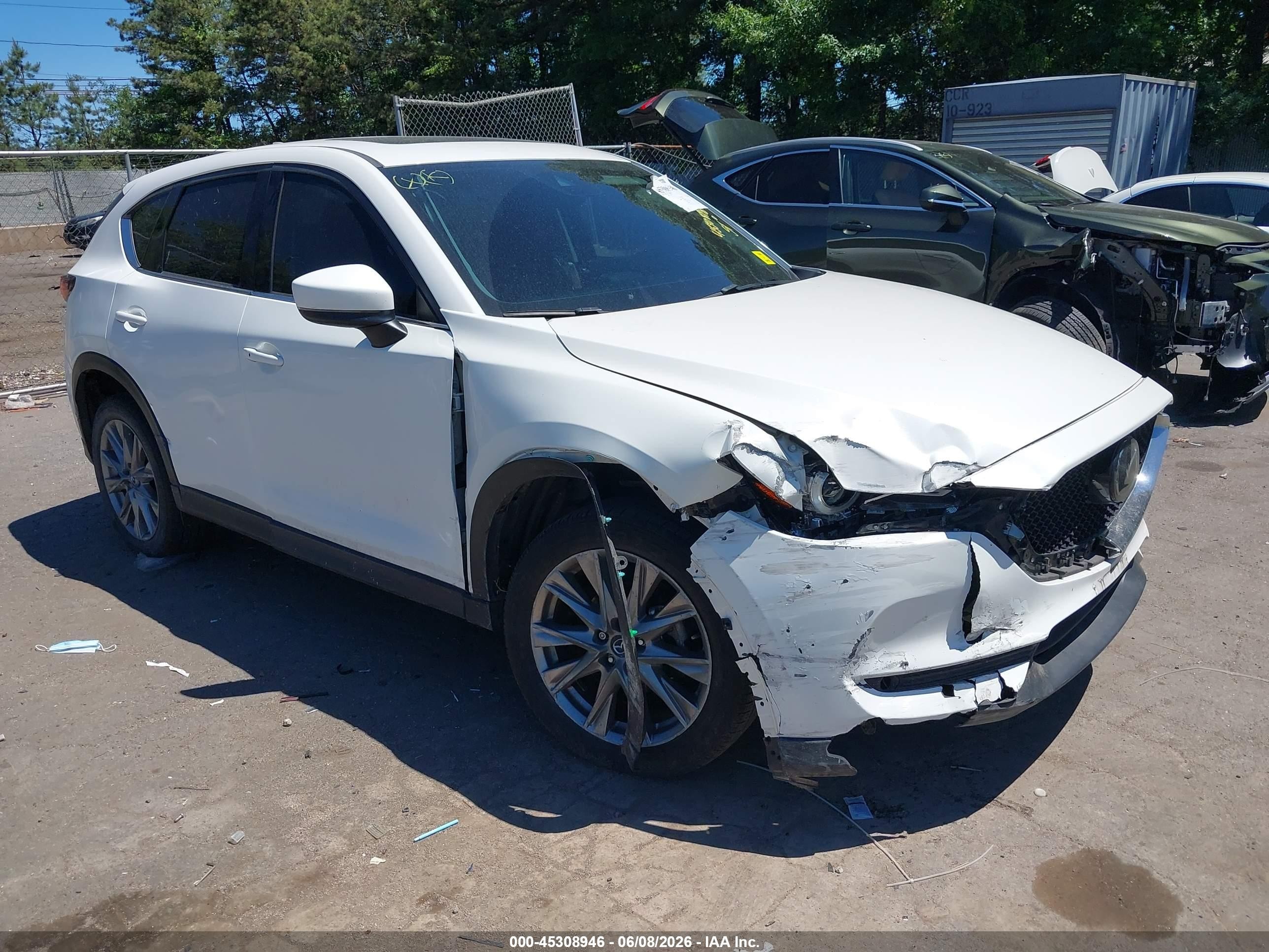 2021 Mazda CX-5 Grand Touring, VIN JM3KFBDM8M1478917 — Side