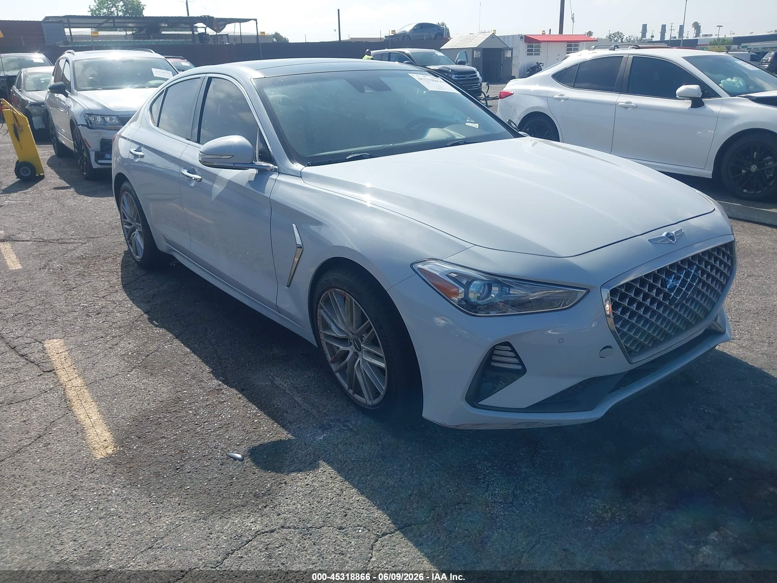 2021 Genesis G70 2.0T, VIN KMTG34LA2MU067068 — Side