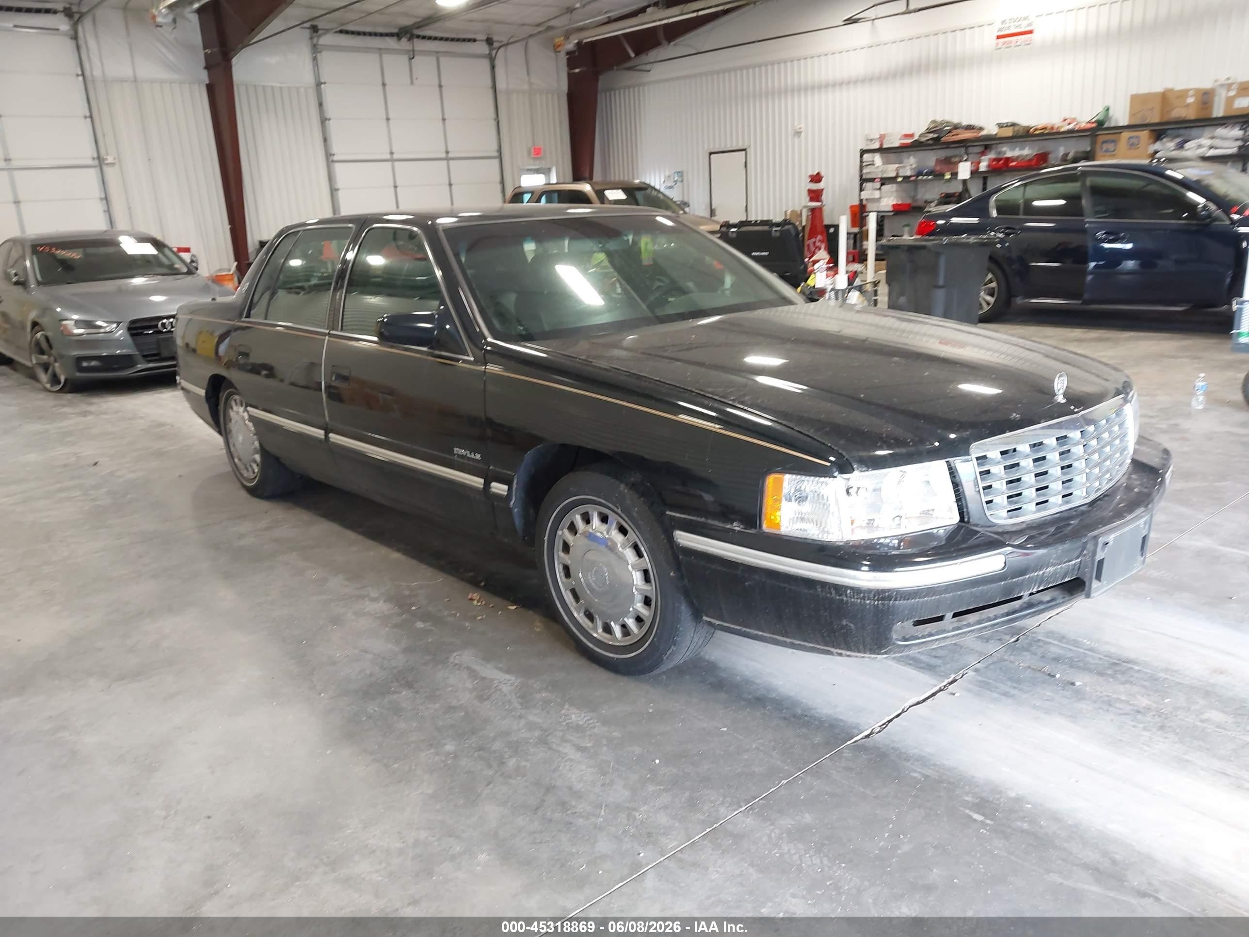 1997 Cadillac DeVille, VIN 1G6KD54Y4VU273746 — Бок