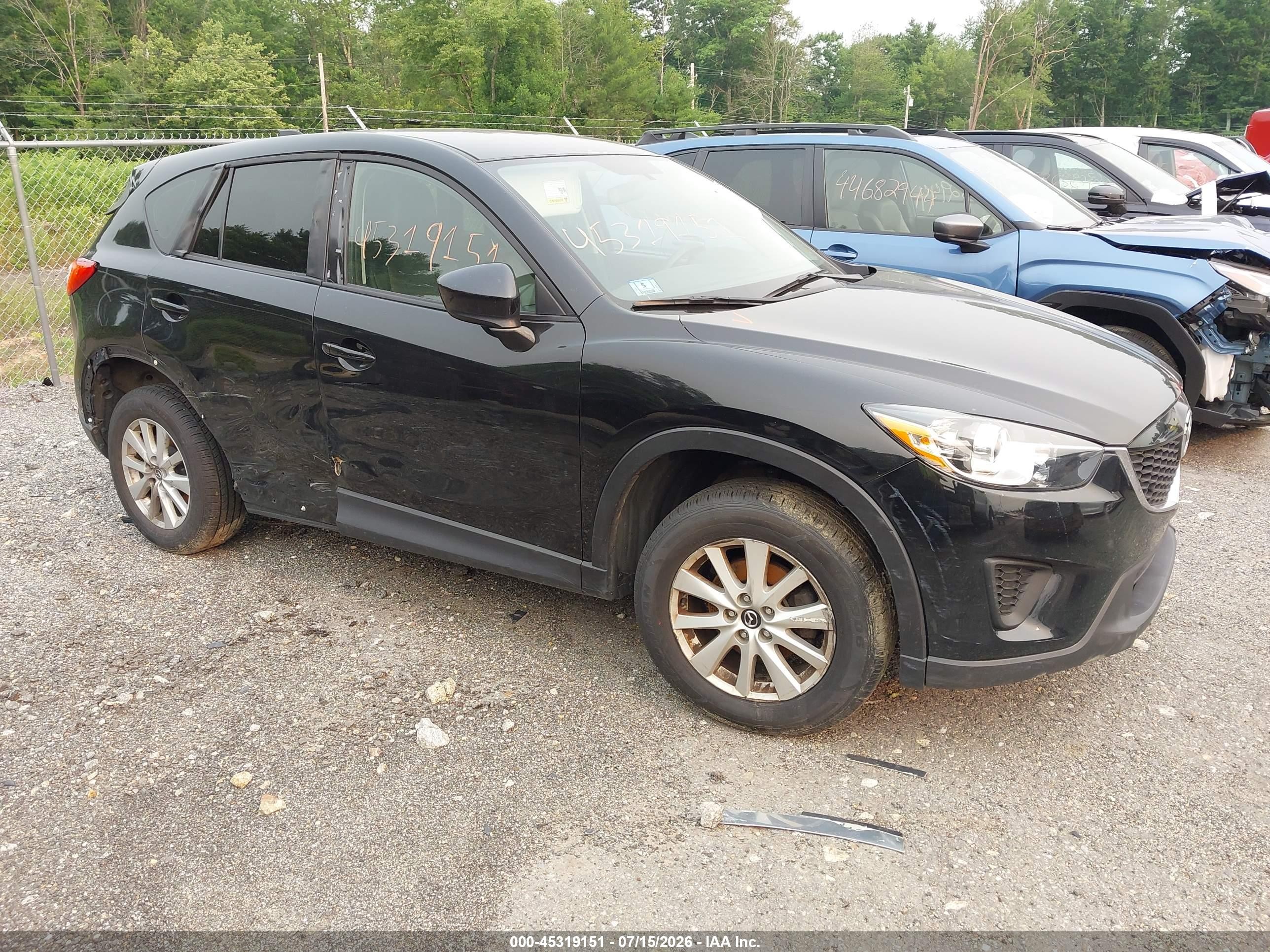 2013 Mazda CX-5 Sport, VIN JM3KE4BE6D0100935 — Side