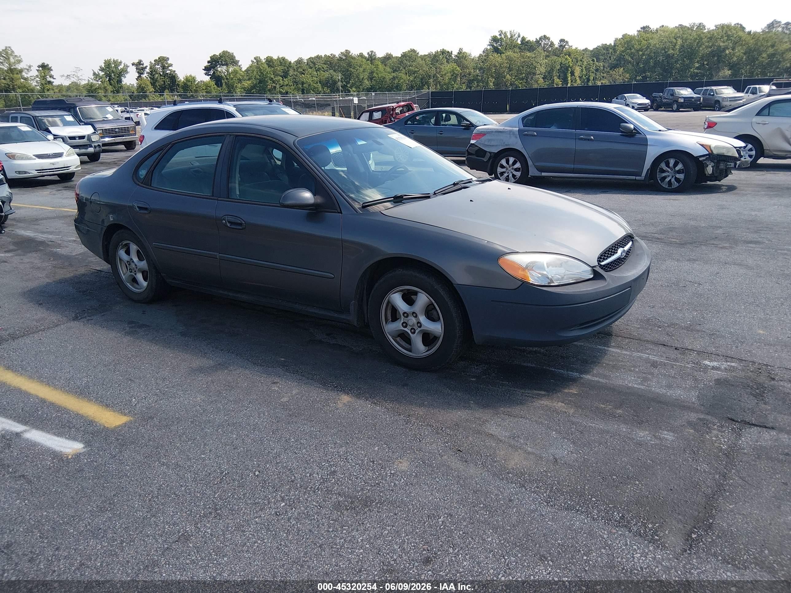 2003 Ford Taurus SE Standard, VIN 1FAFP53U13G157538 — Side