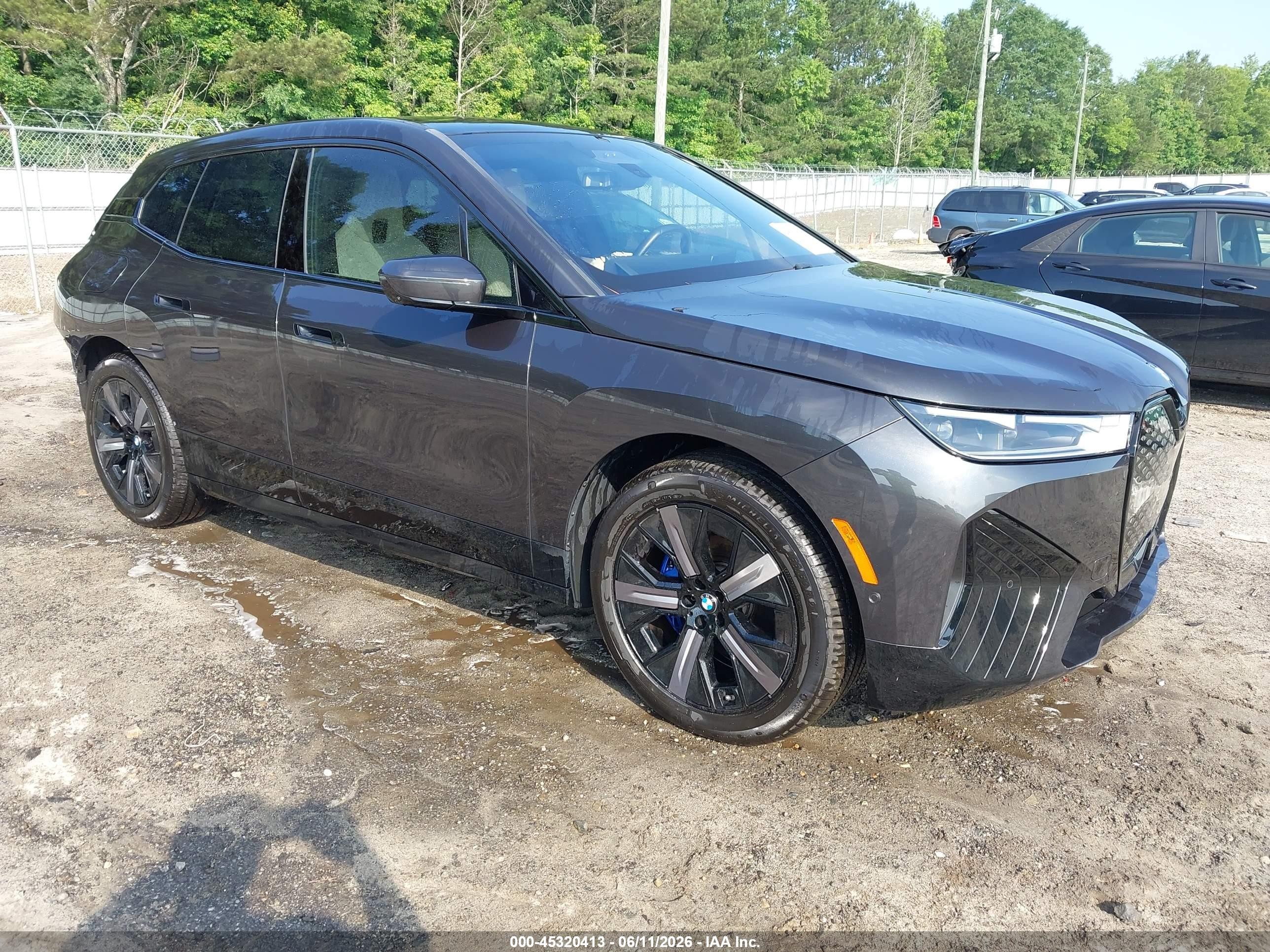 2025 BMW iX xDrive50, VIN WB523CF04SCS15712 — Rear end