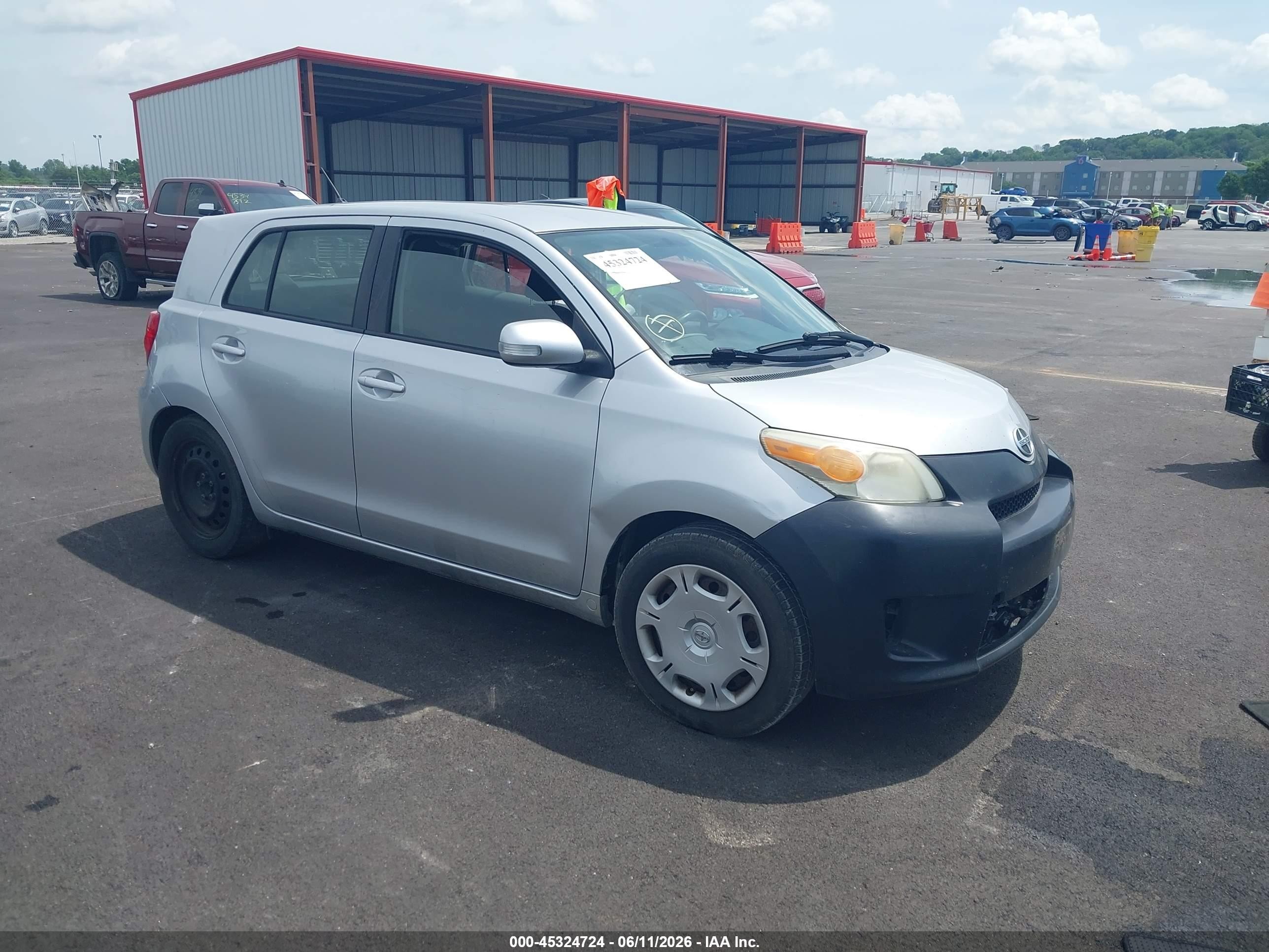 2012 Scion xD, VIN JTKKU4B41C1015618 — Side