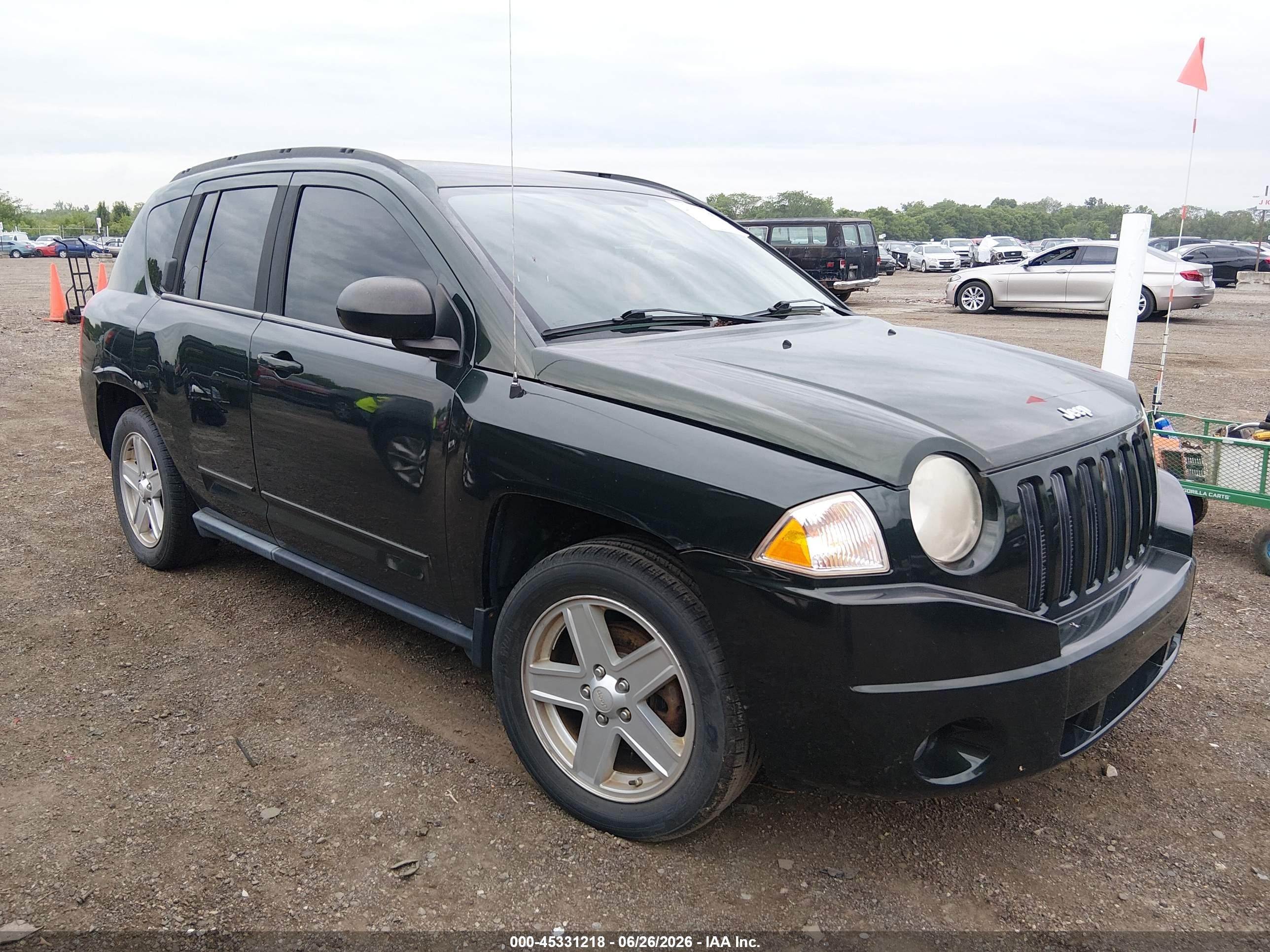 2010 Jeep Compass Sport, VIN 1J4NF4FB6AD611689 — Normal wear