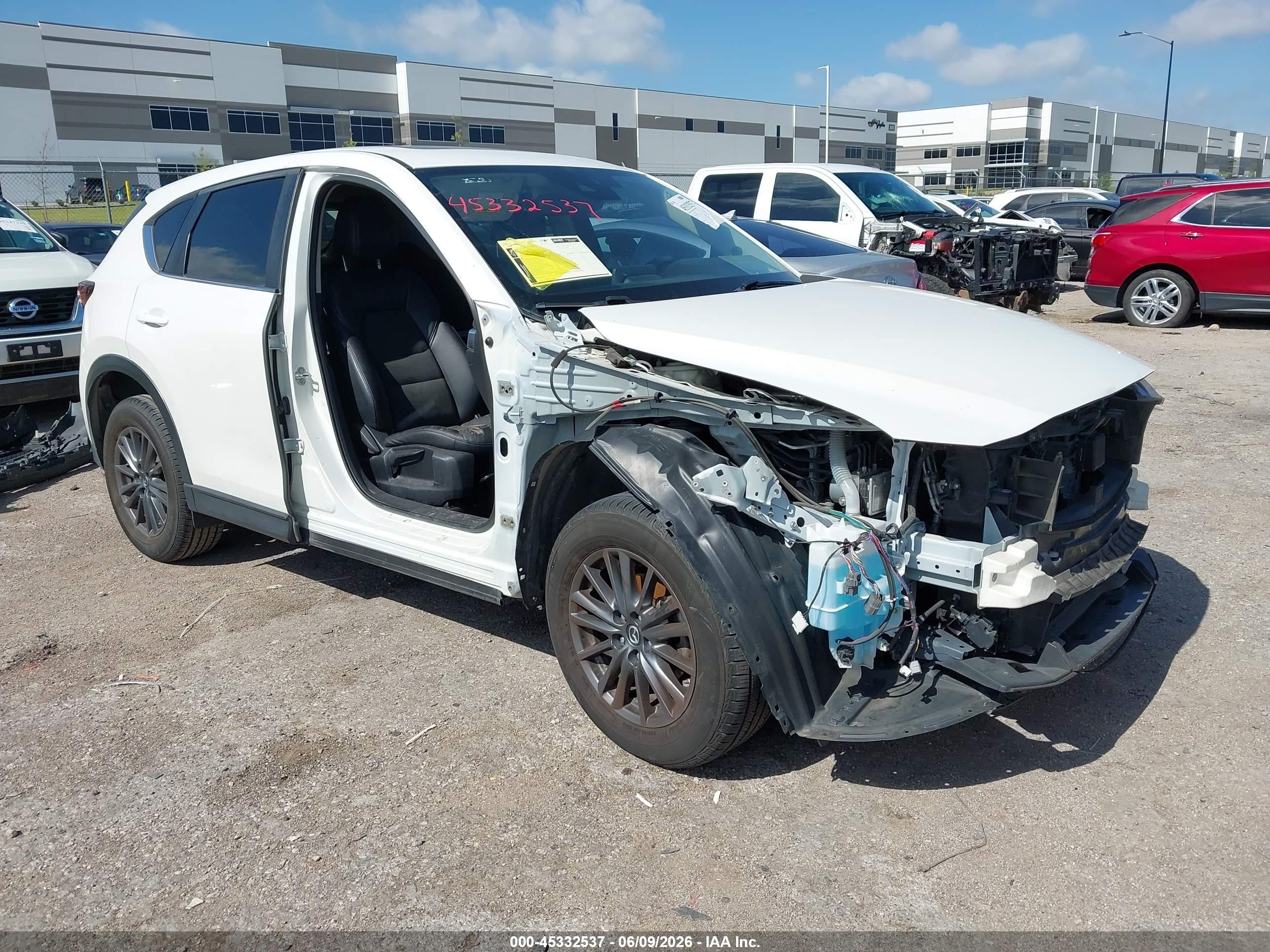 2020 Mazda CX-5 Touring, VIN JM3KFACM3L0722621 — Side