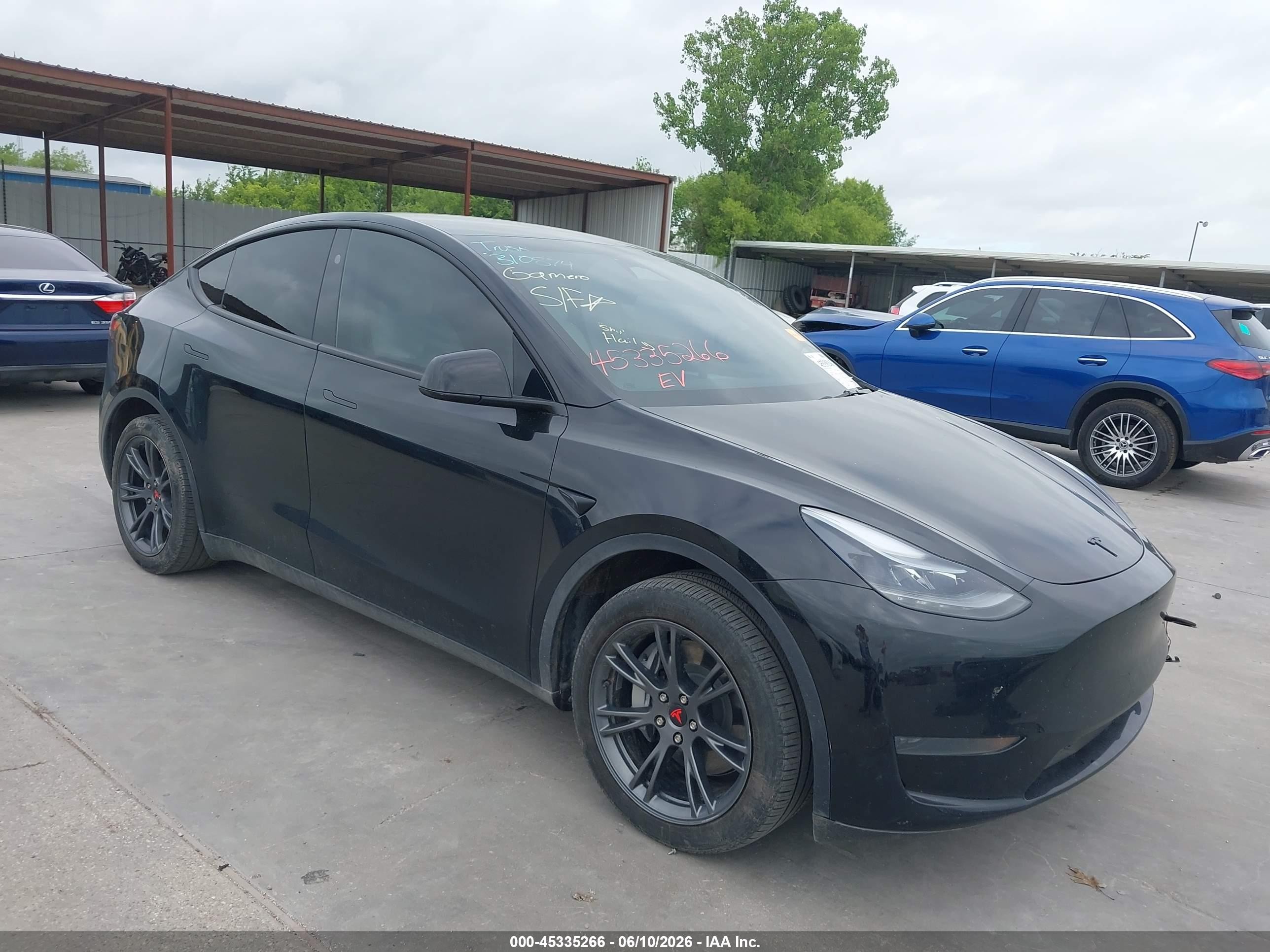 2024 Tesla Model Y, VIN 7SAYGDED9RA310874 — Undercarriage