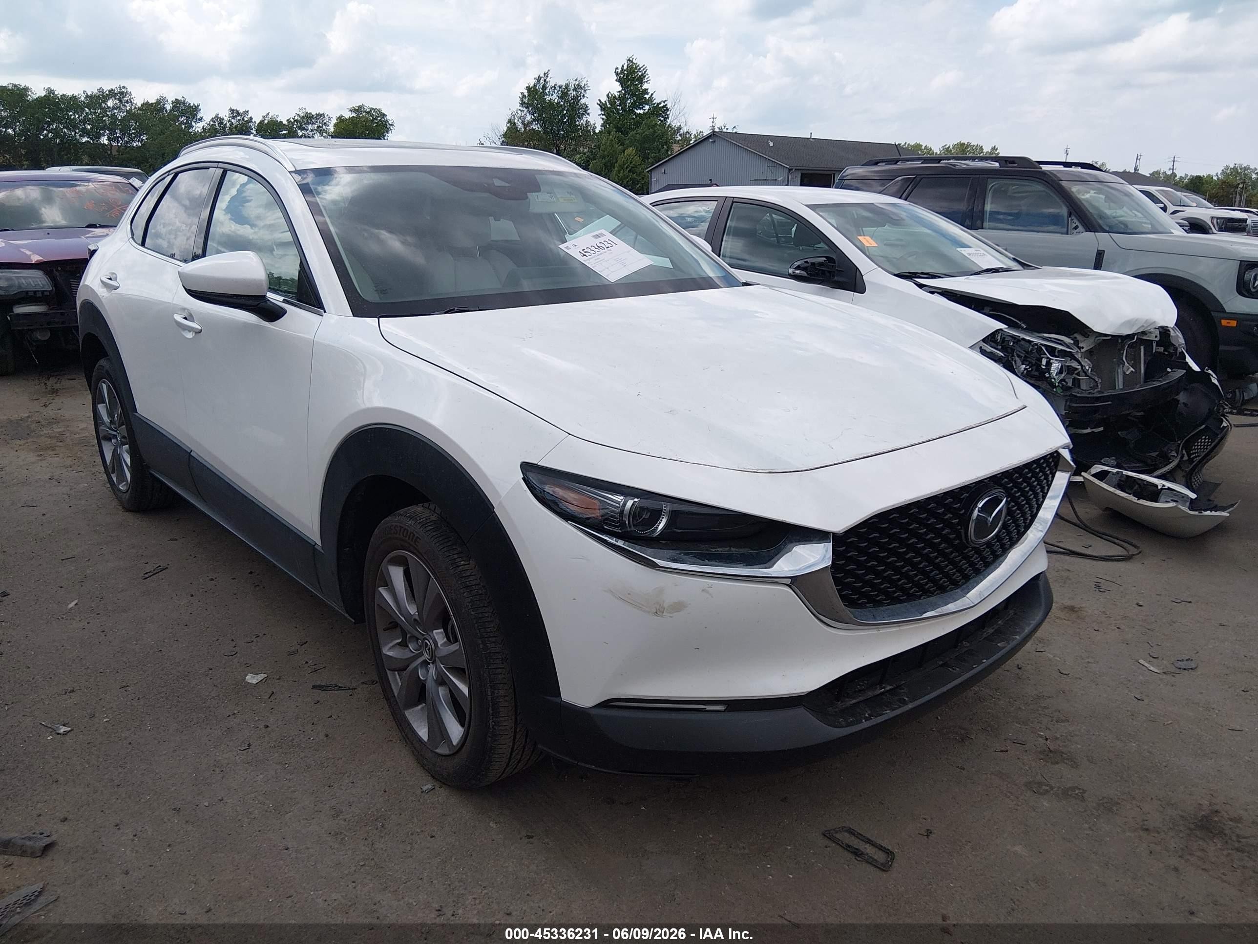 2022 Mazda CX-30 S Premium, VIN 3MVDMBDLXNM404139 — Hail
