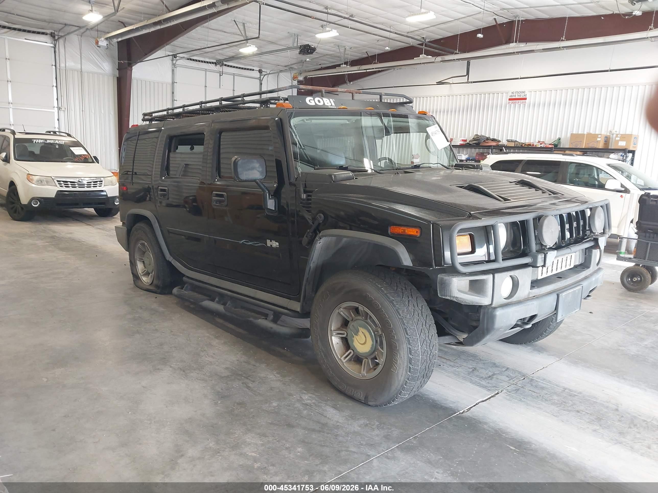 2004 Hummer H2, VIN 5GRGN23U44H108766 — Side