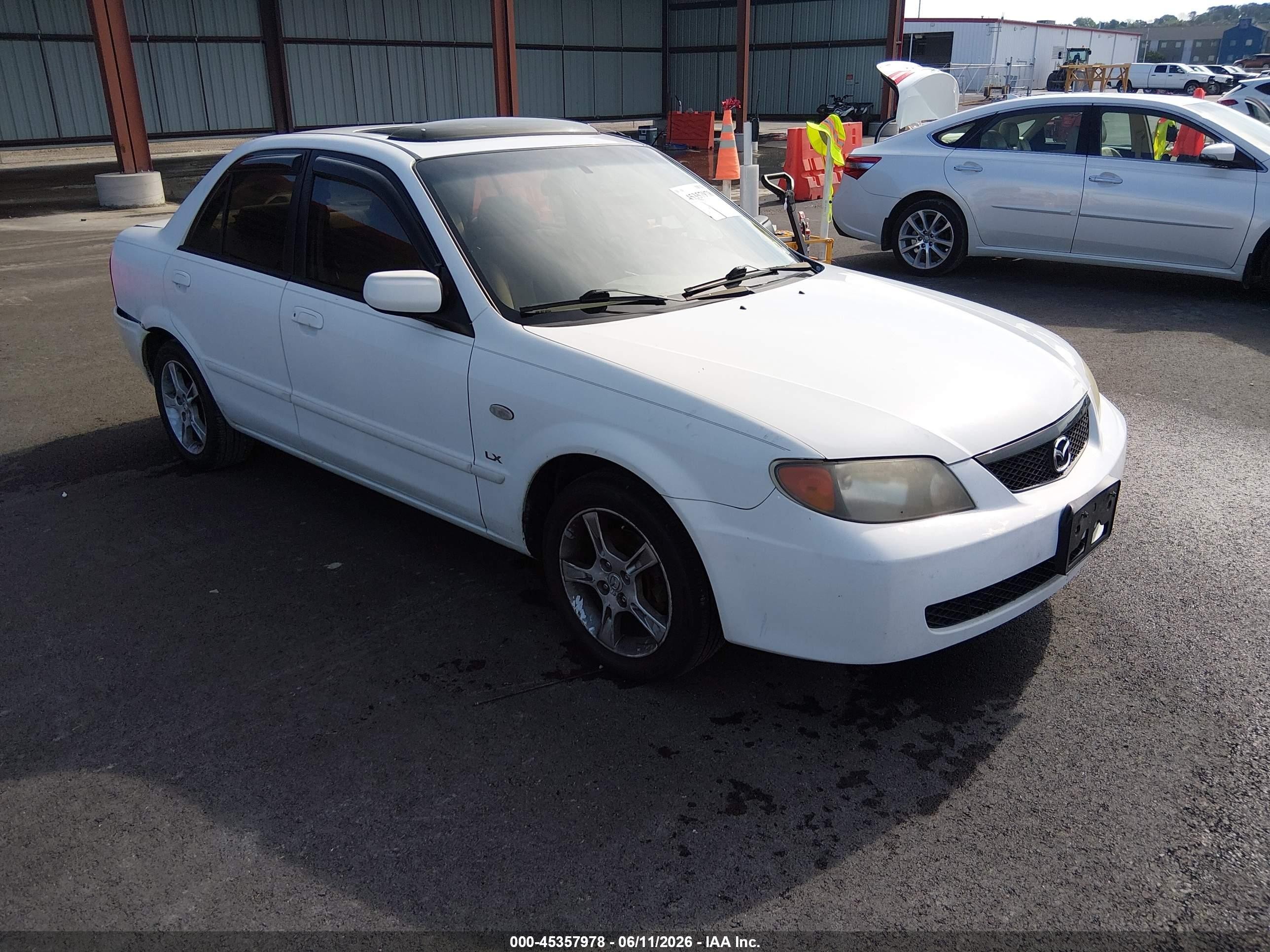 2003 Mazda Protege DX, VIN JM1BJ225130149564 — Зад