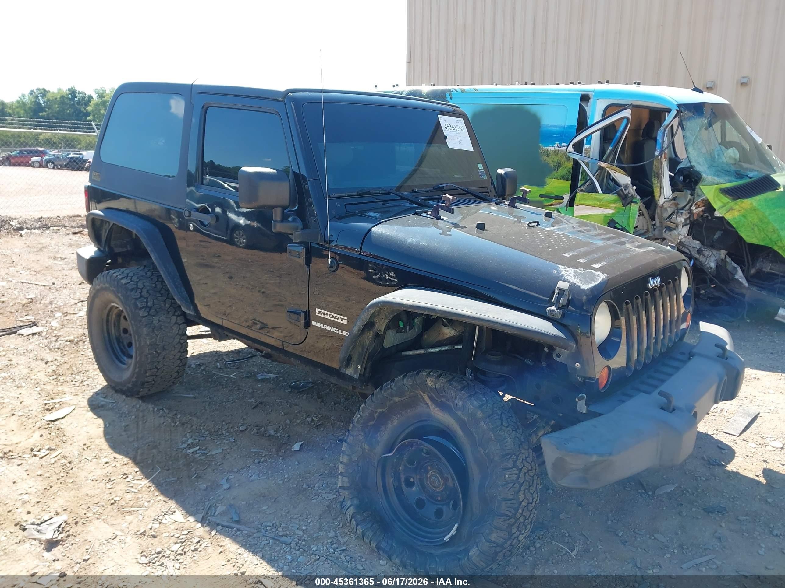 2012 Jeep Wrangler Sport, VIN 1C4AJWAGXCL169154 — Side