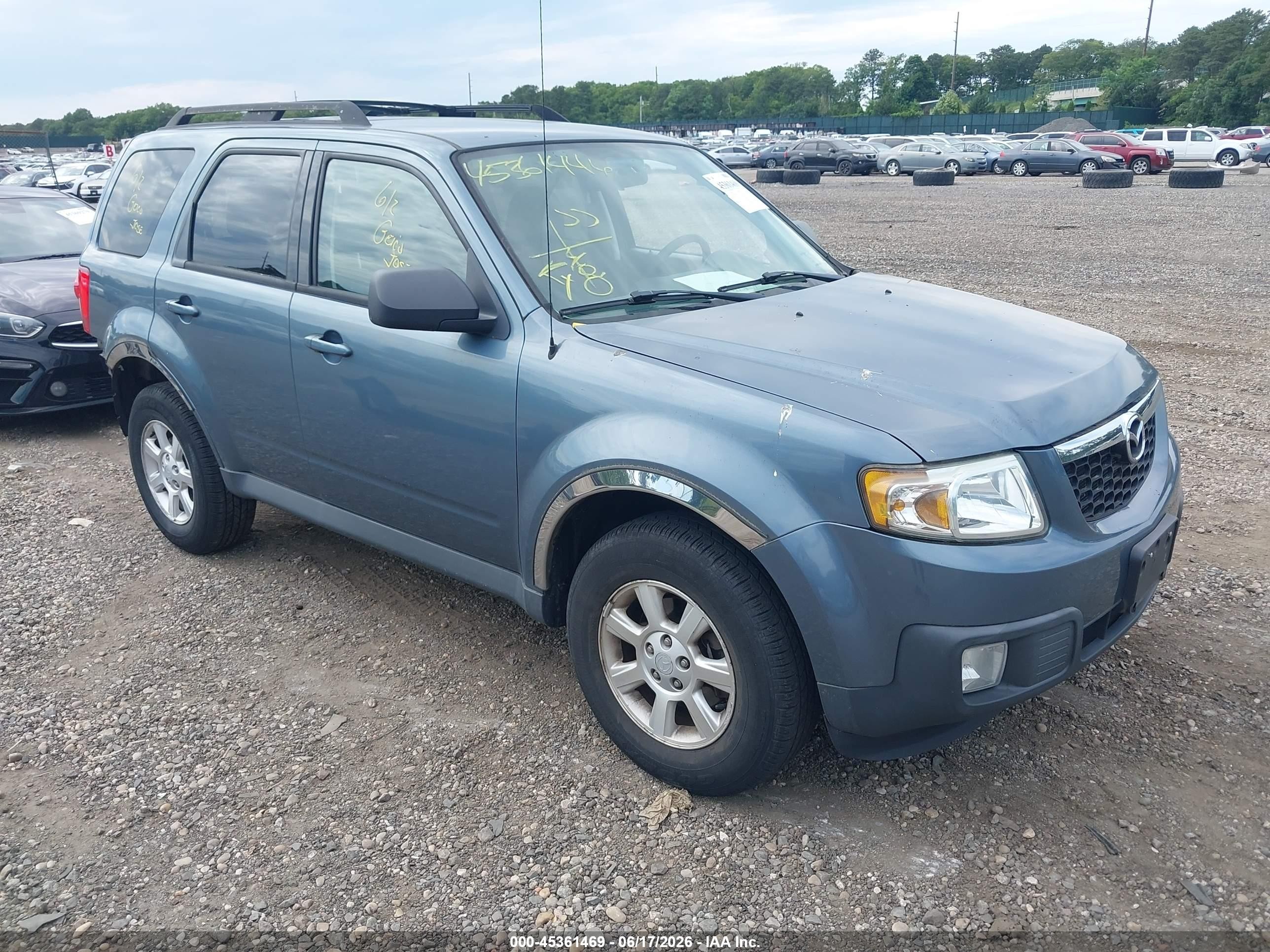 2011 Mazda Tribute Touring, VIN 4F2CY9C78BKM00043 — Зад