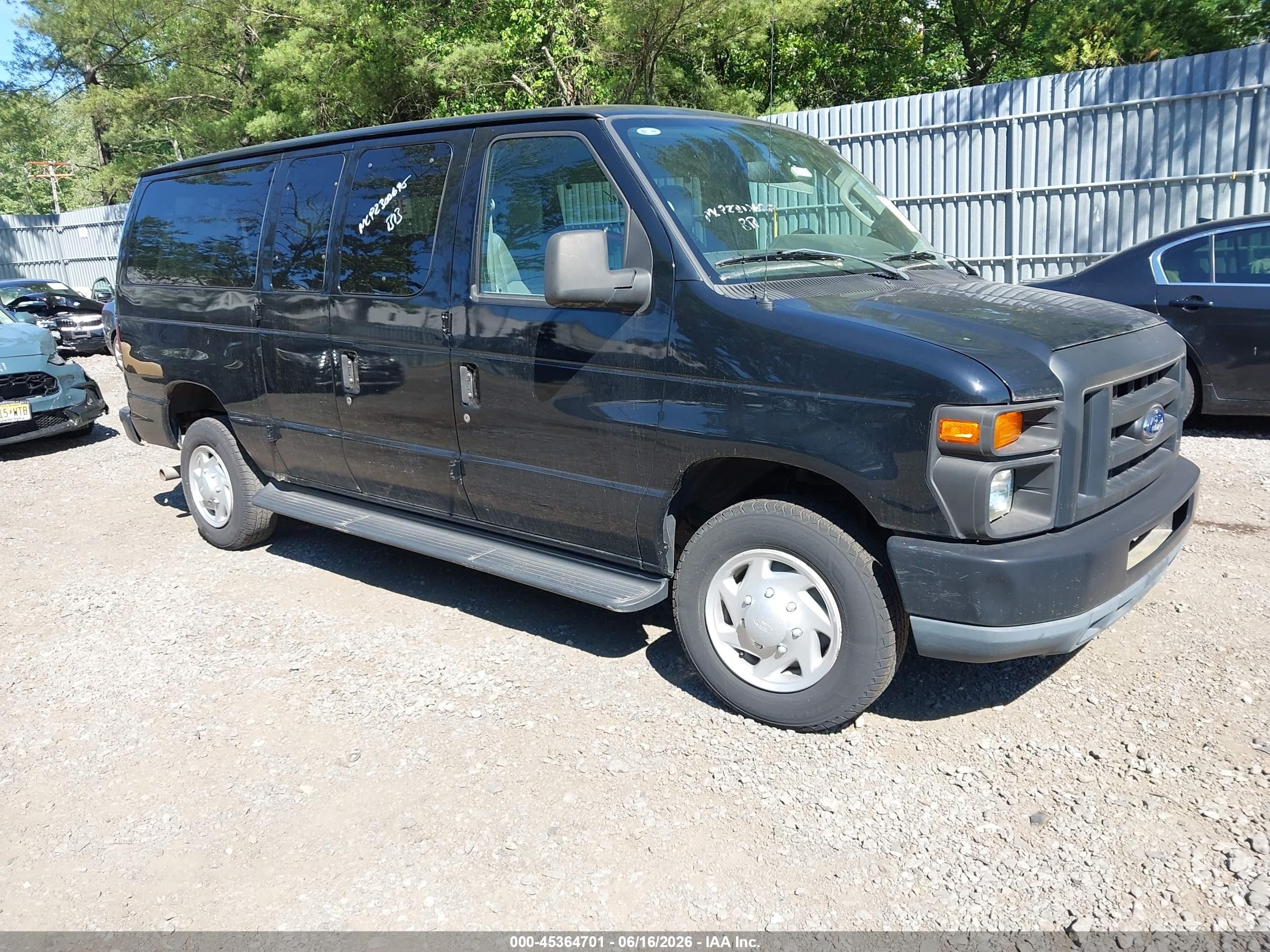2011 Ford Econoline Passenger XLT, VIN 1FBNE3BL7BDA03204 — Side