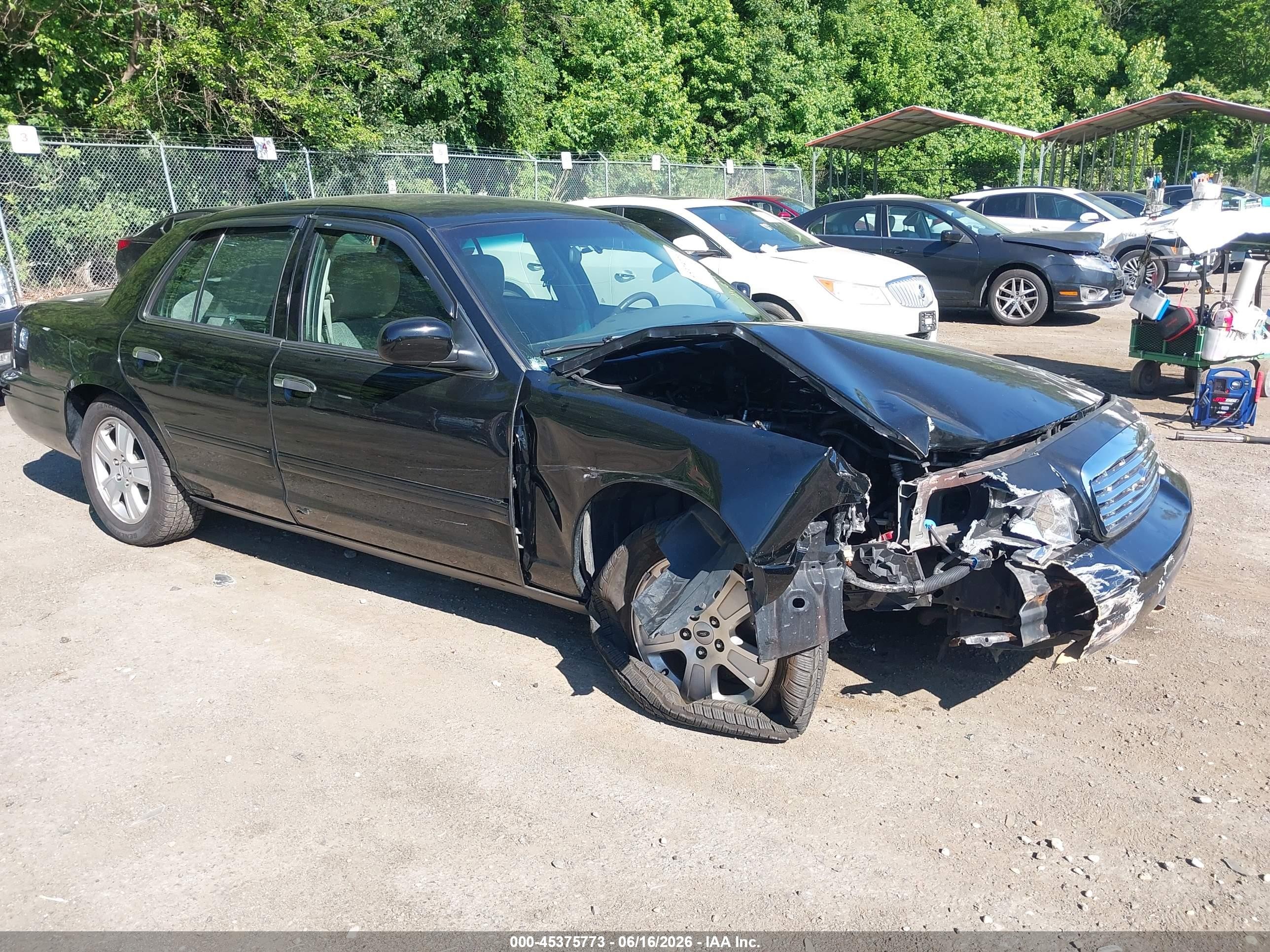 2011 Ford Crown Victoria LX, VIN 2FABP7EV8BX184616 — Side