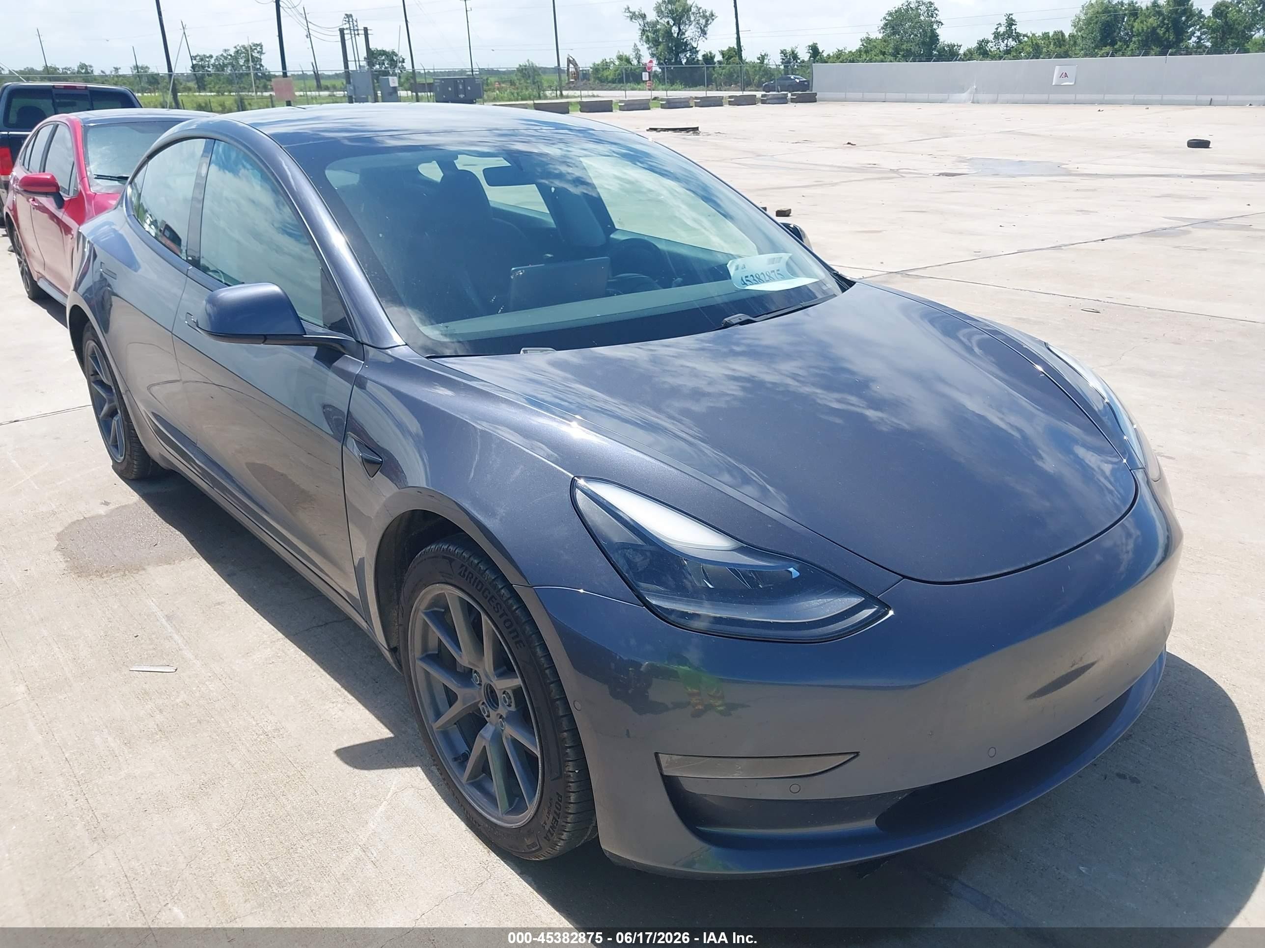 2021 Tesla Model 3 Standard Range Plus, VIN 5YJ3E1EA8MF866882 — Auction photo