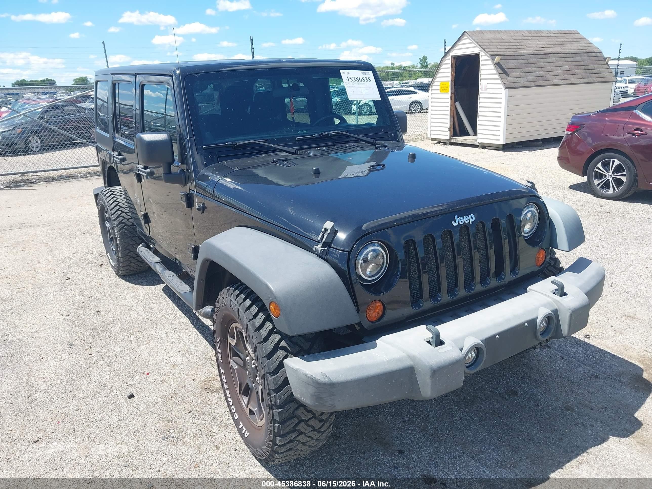 2011 Jeep Wrangler Unlimited Sport, VIN 1J4BA3H15BL522168 — Side