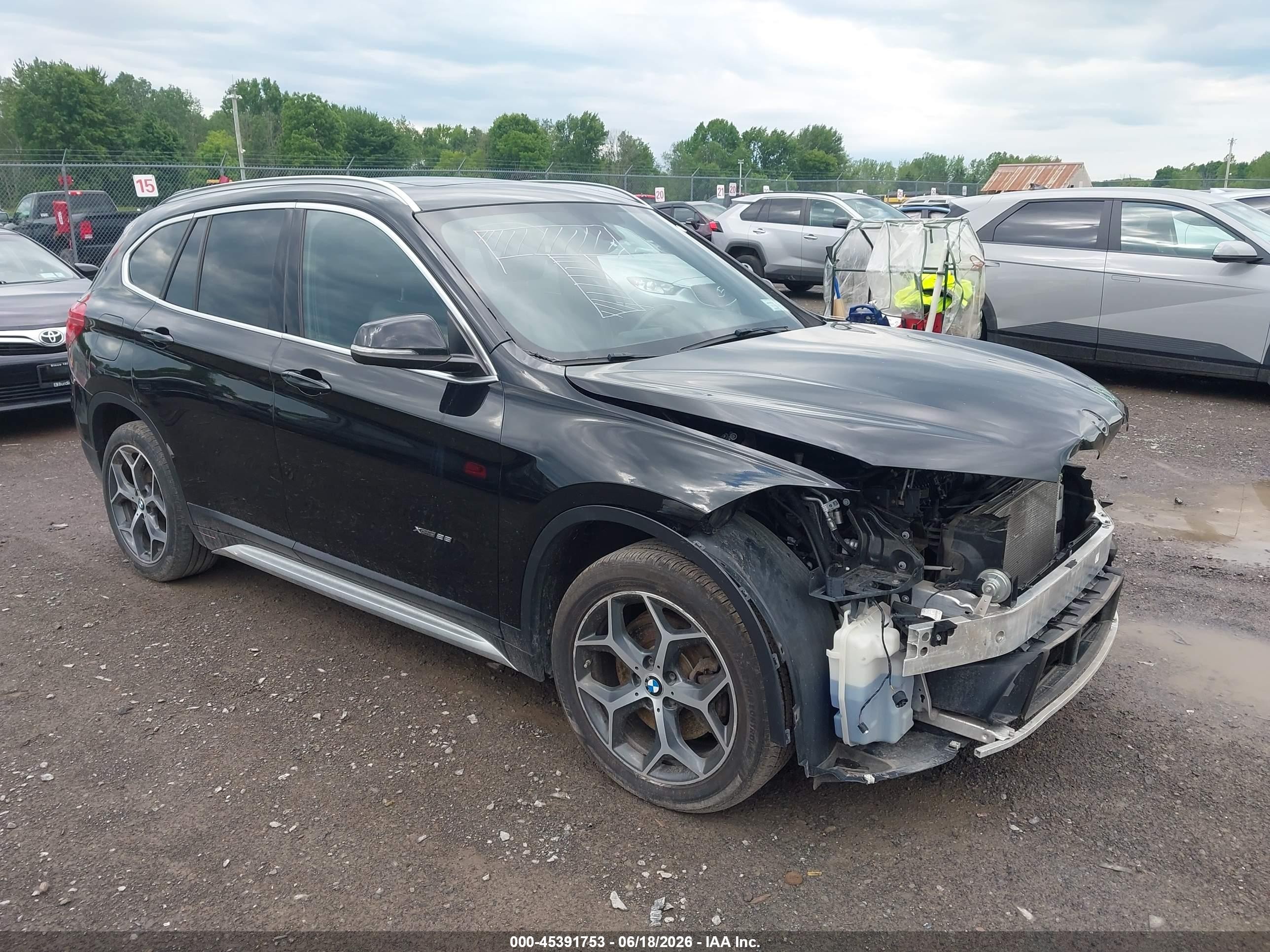 2018 BMW X1 xDrive28i, VIN WBXHT3C36J5K25869 — Front end