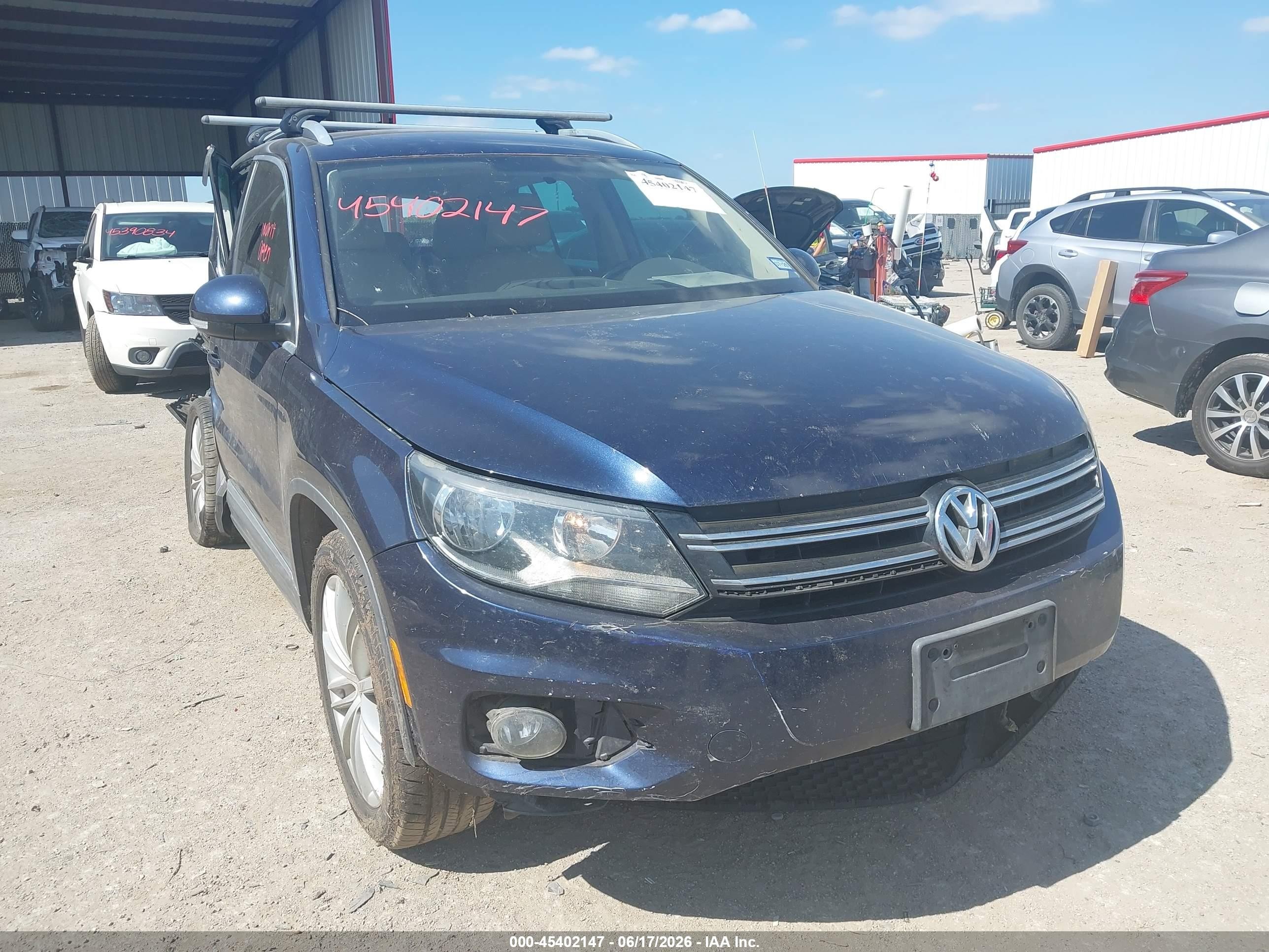2014 Volkswagen Tiguan S, VIN WVGAV3AX3EW522320 — Side
