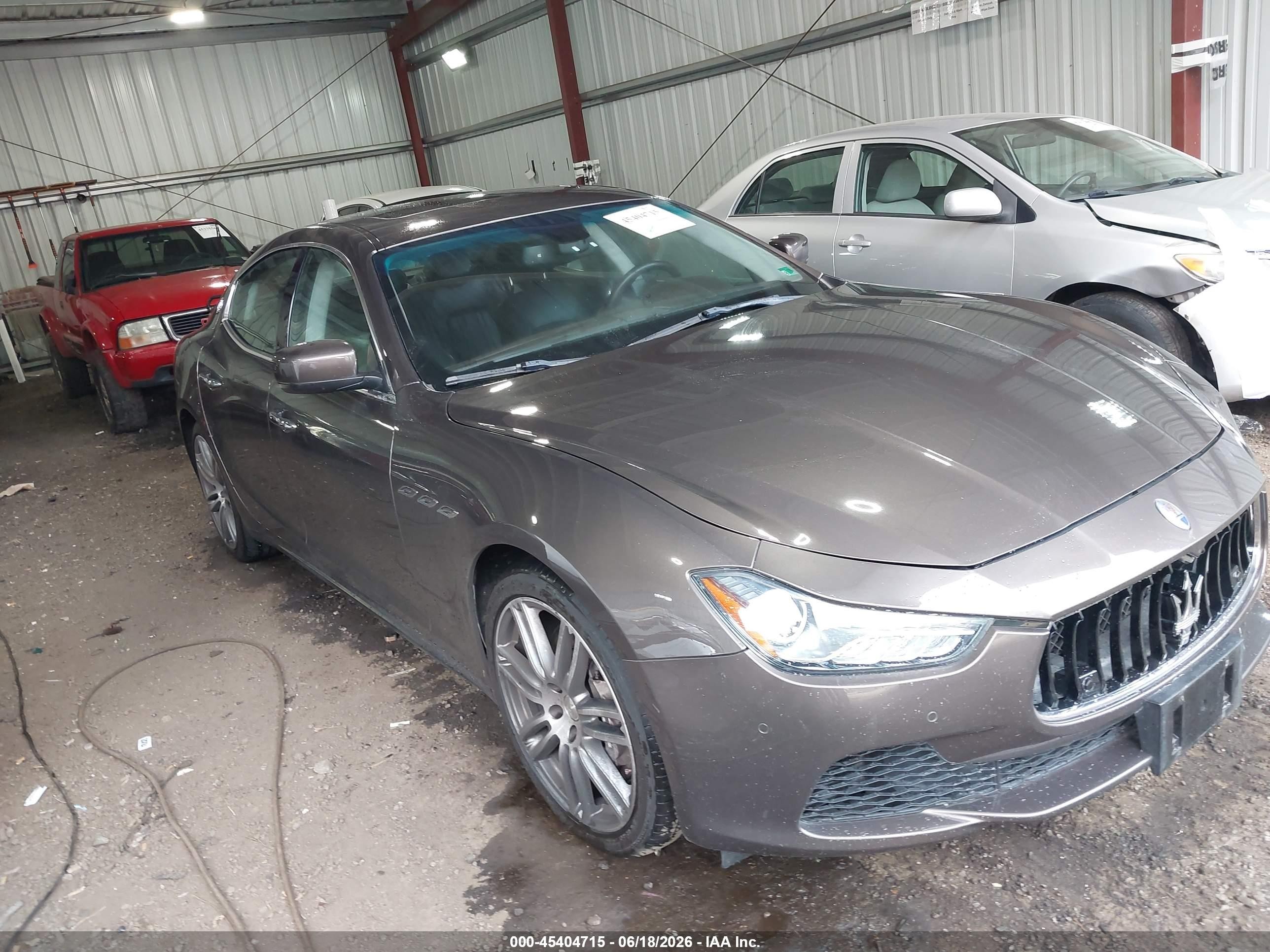 2014 Maserati Ghibli, VIN ZAM57XSA2E1127894 — Side