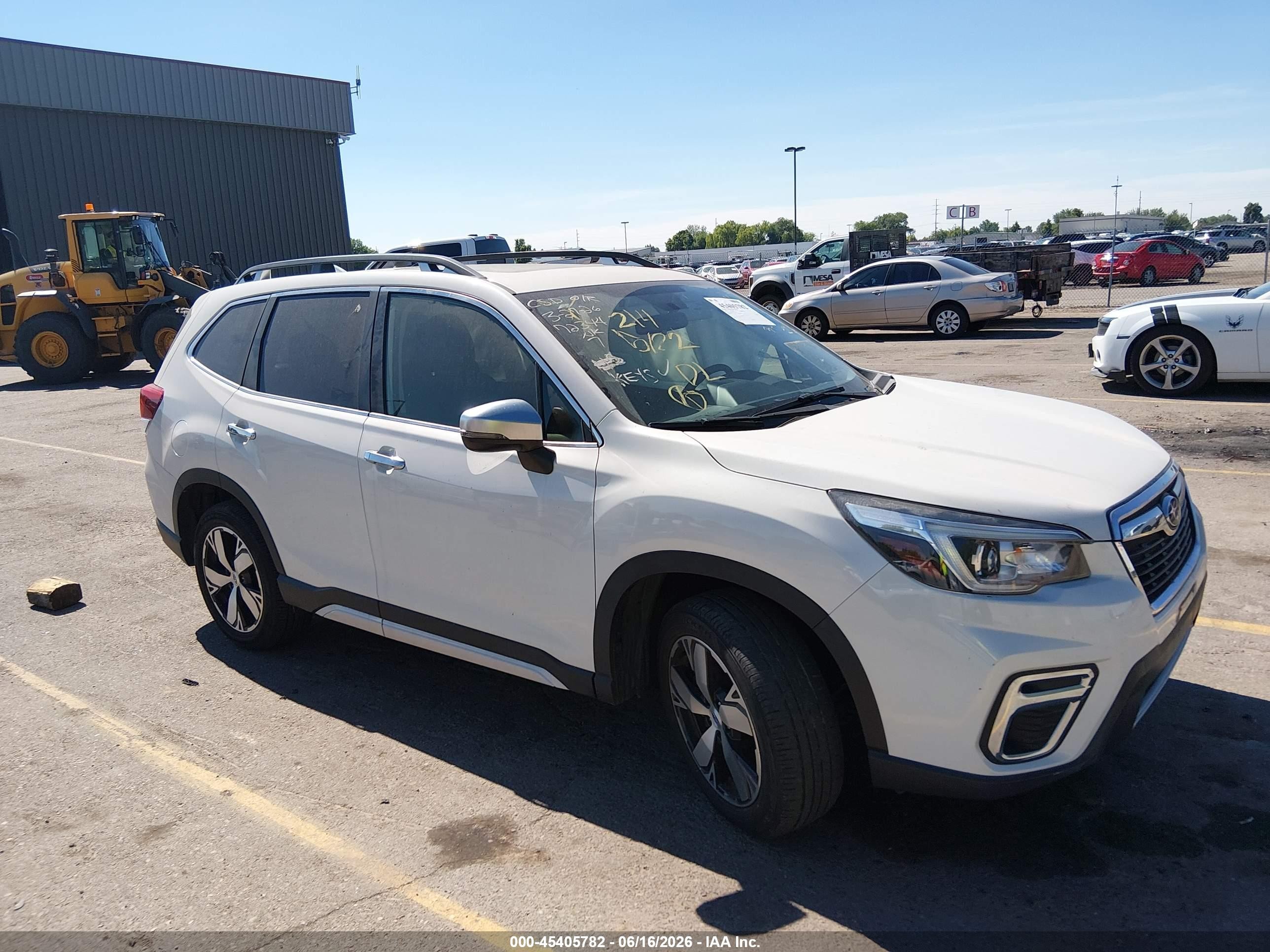 2019 Subaru Forester Touring, VIN JF2SKAWC7KH463186 — Side