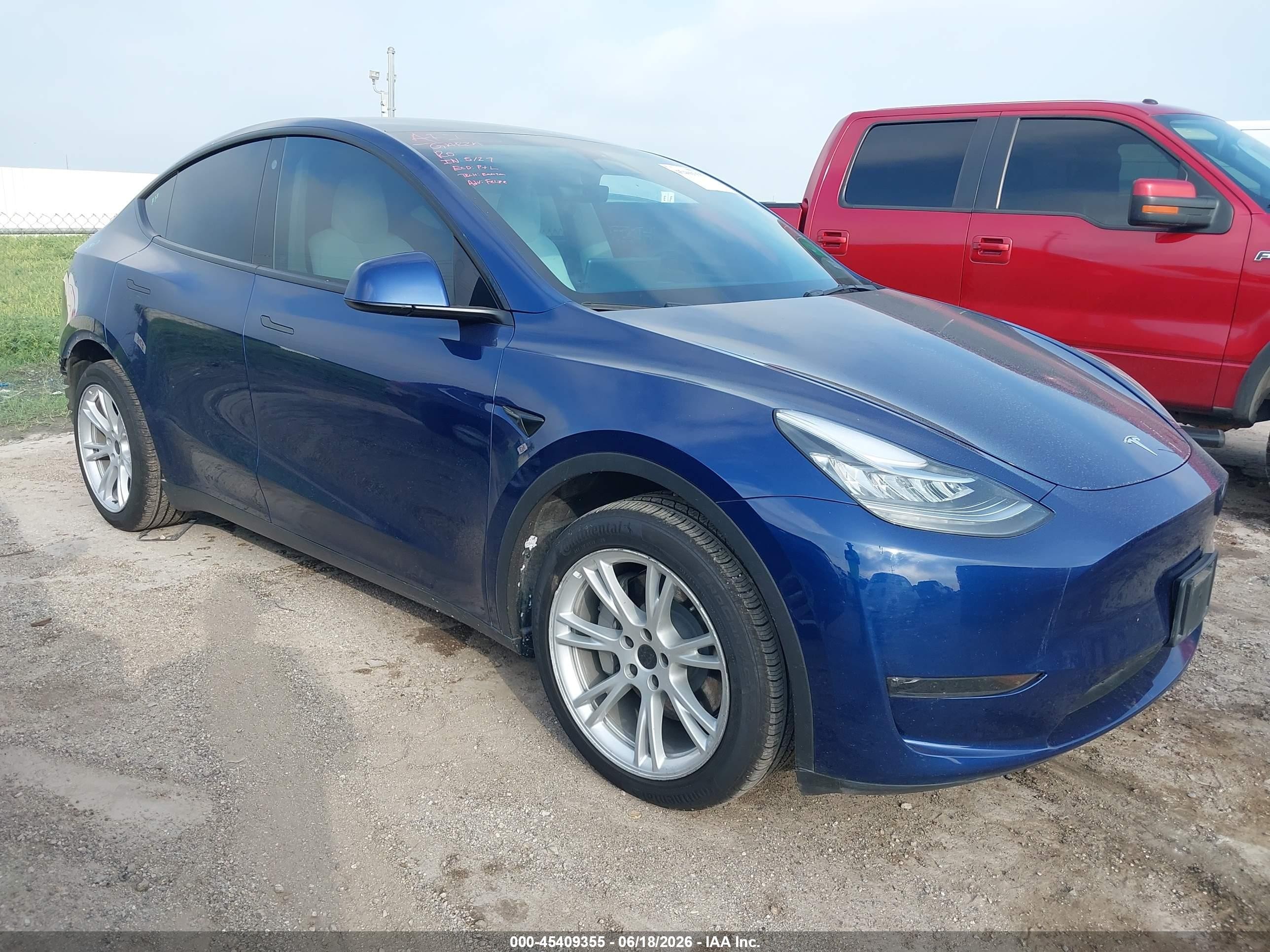 2023 Tesla Model Y Long Range, VIN 7SAYGDEE6PF604595 — Rear end