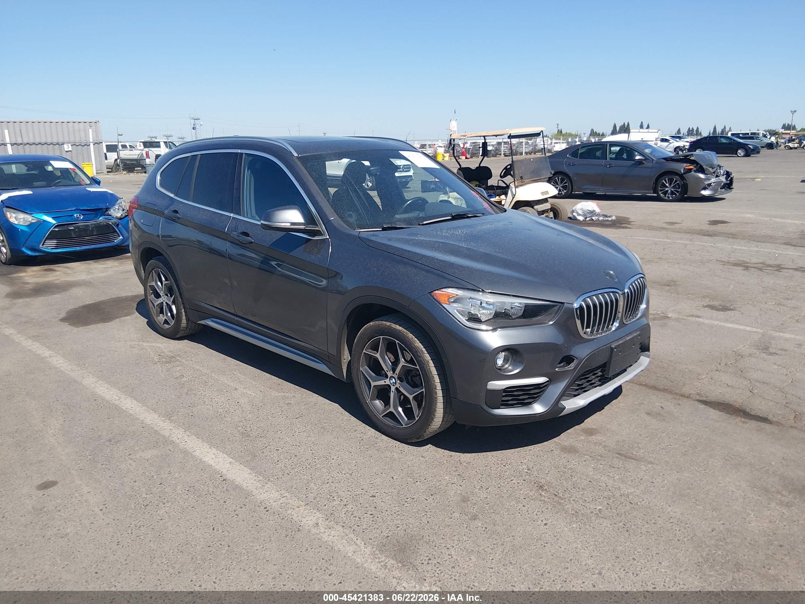 2018 BMW X1 xDrive28i, VIN WBXHT3C33J5K31144 — Side