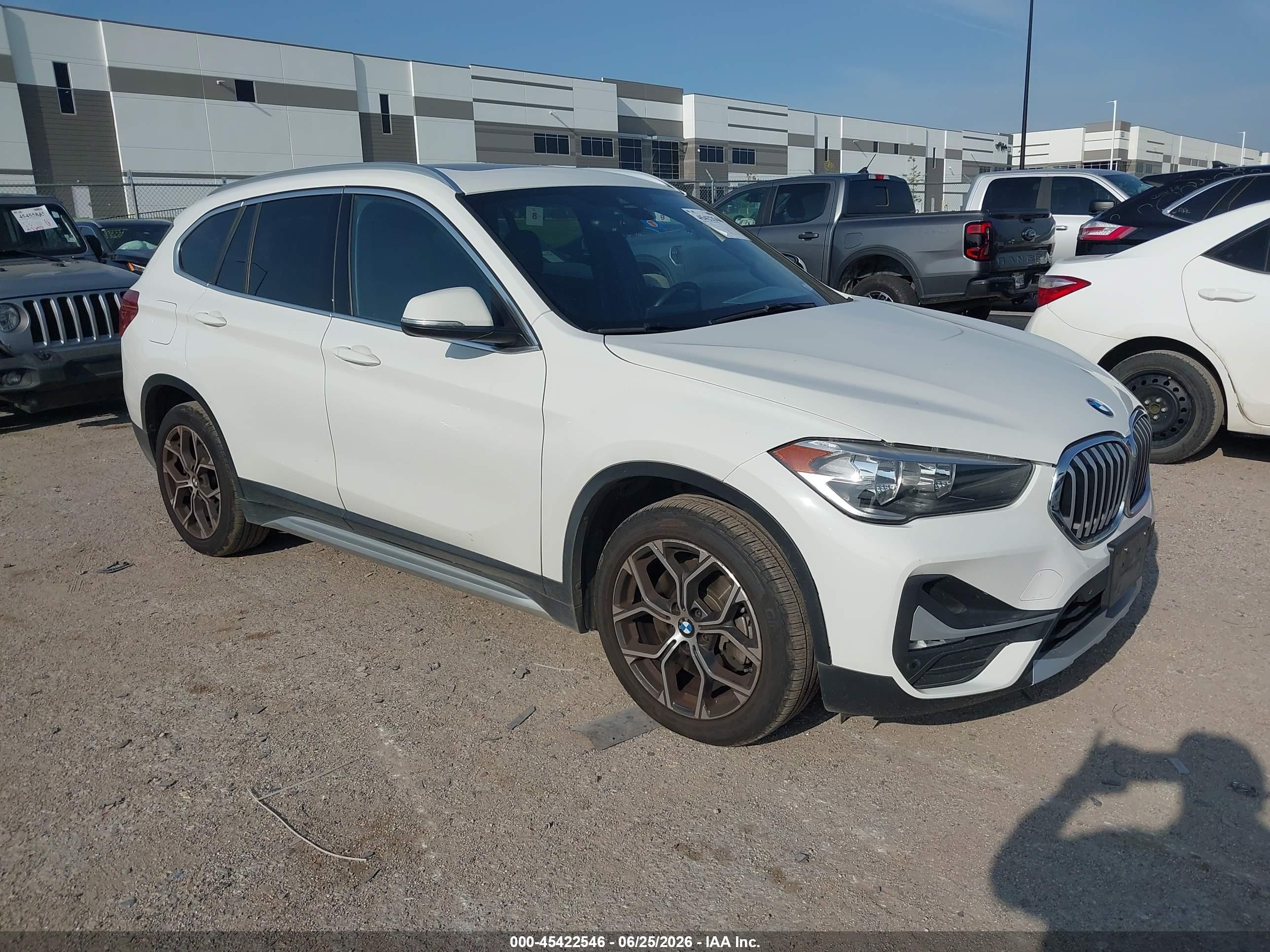 2020 BMW X1 sDrive28i, VIN WBXJG7C04L3L81684 — Side