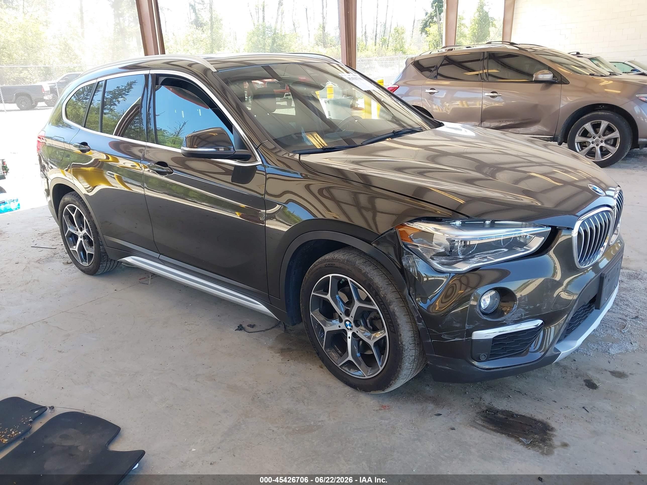 2019 BMW X1 xDrive28i, VIN WBXHT3C58K5L36023 — Side