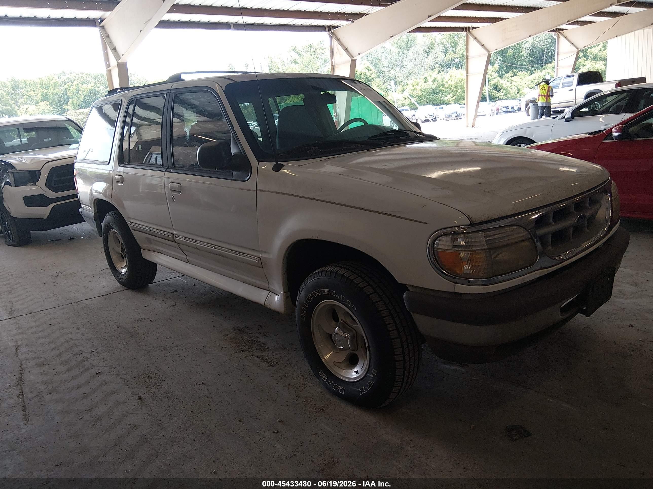 1997 Ford Explorer XL, VIN 1FMDU34E6VUD31643 — Side
